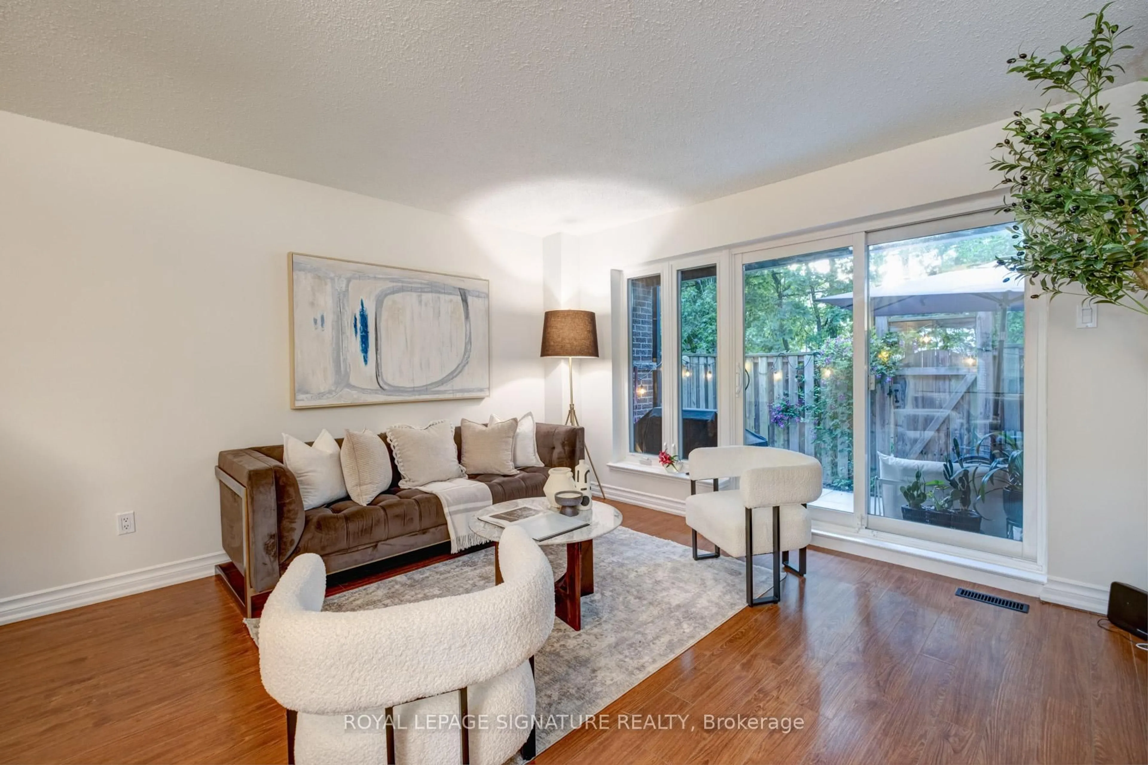 Living room with furniture, wood/laminate floor for 28 Livingston Rd #47, Toronto Ontario M1E 4S5