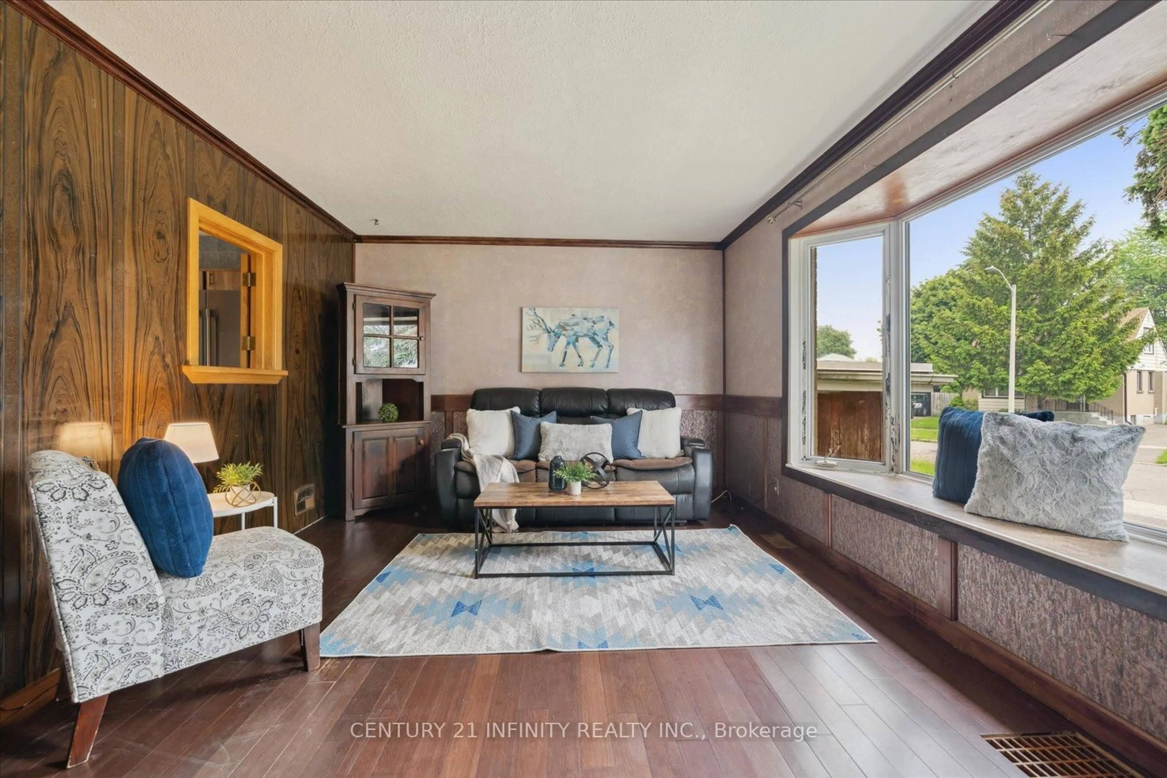 Living room with furniture, wood/laminate floor for 9 Forest Rd, Ajax Ontario L1S 2N2
