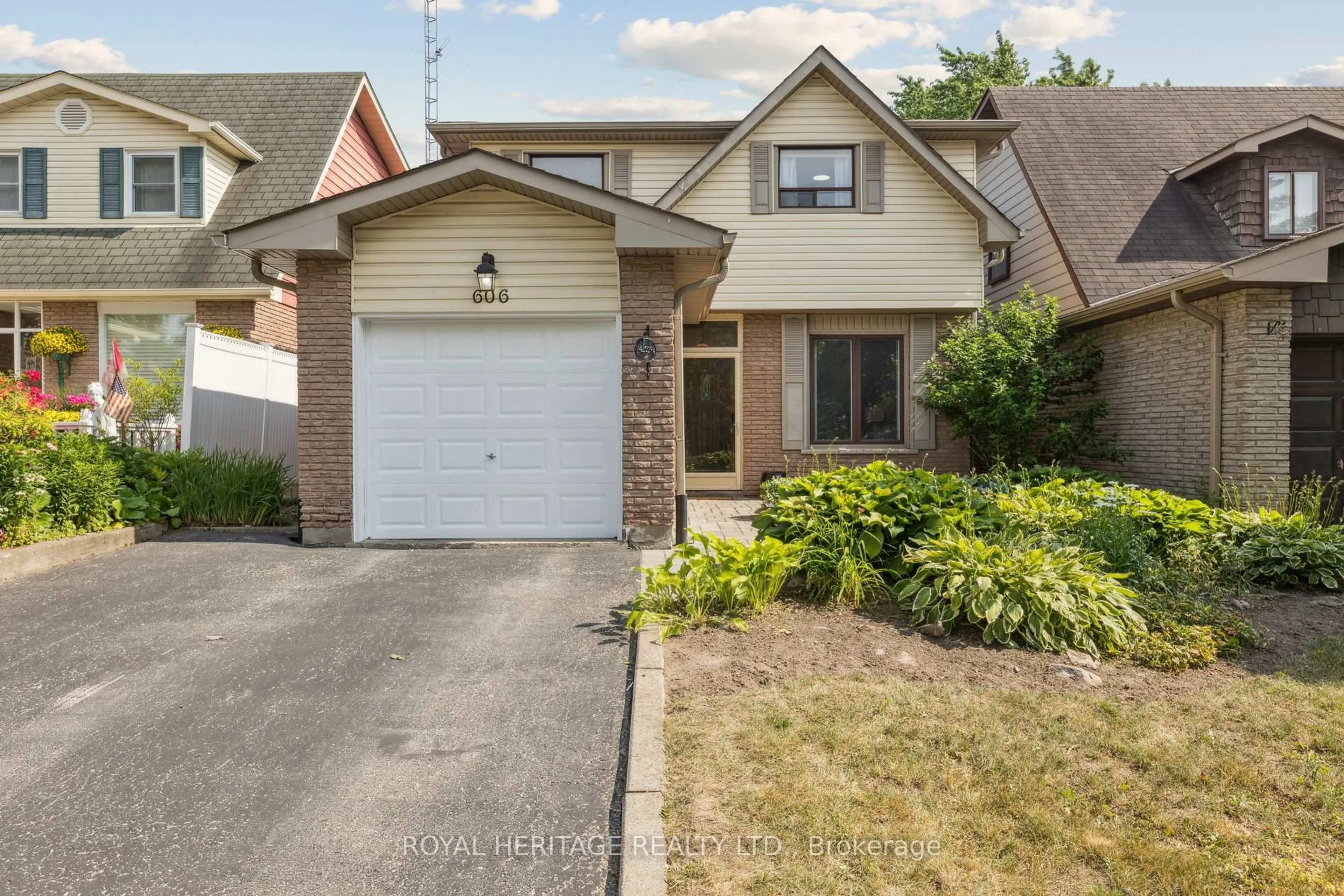 Home with brick exterior material, street for 606 Stonebridge Lane, Pickering Ontario L1W 3B3