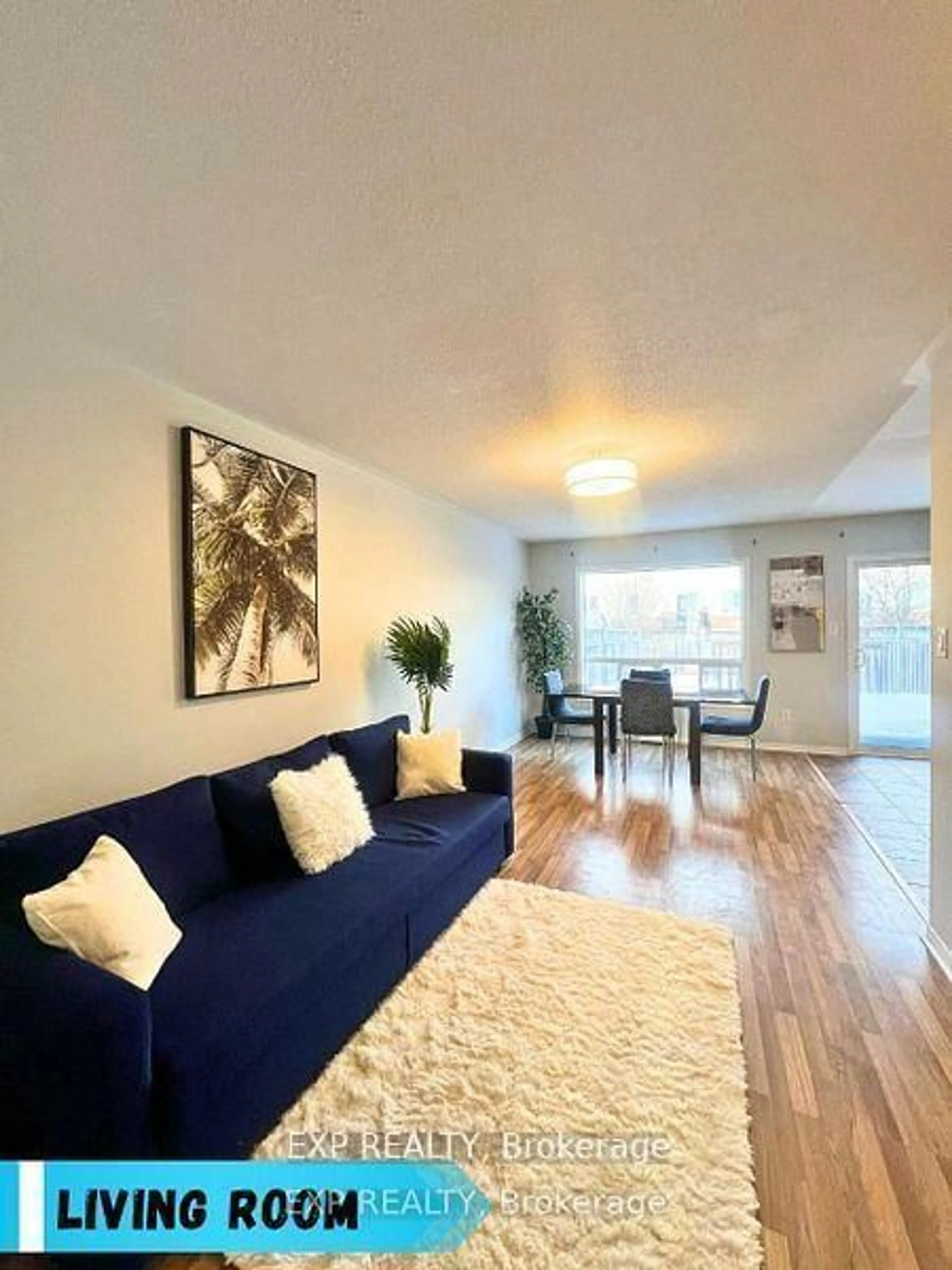 Living room with furniture, wood/laminate floor for 1523 Glenbourne Dr, Oshawa Ontario L1K 0M5
