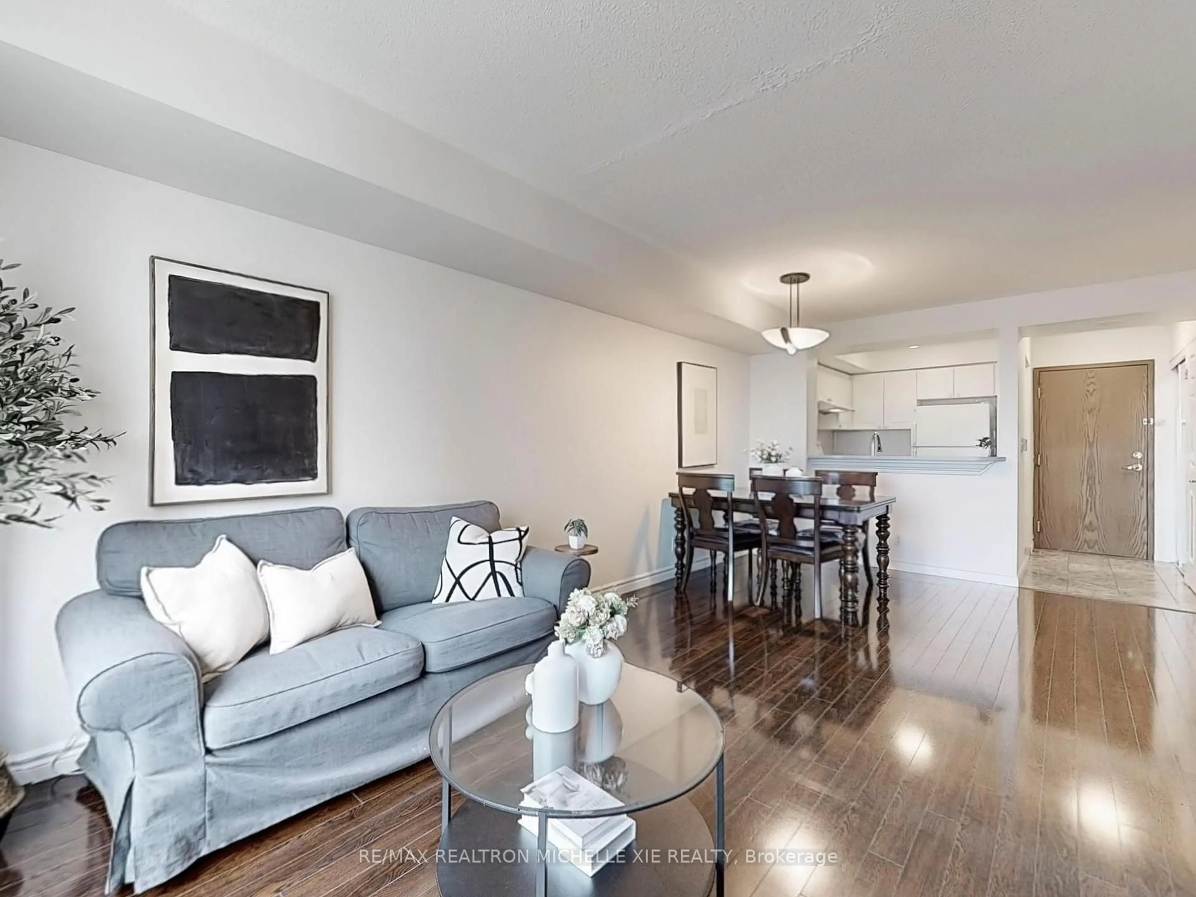 Living room with furniture, wood/laminate floor for 1 Lee Centre Dr #Ph201, Toronto Ontario M1H 3J2