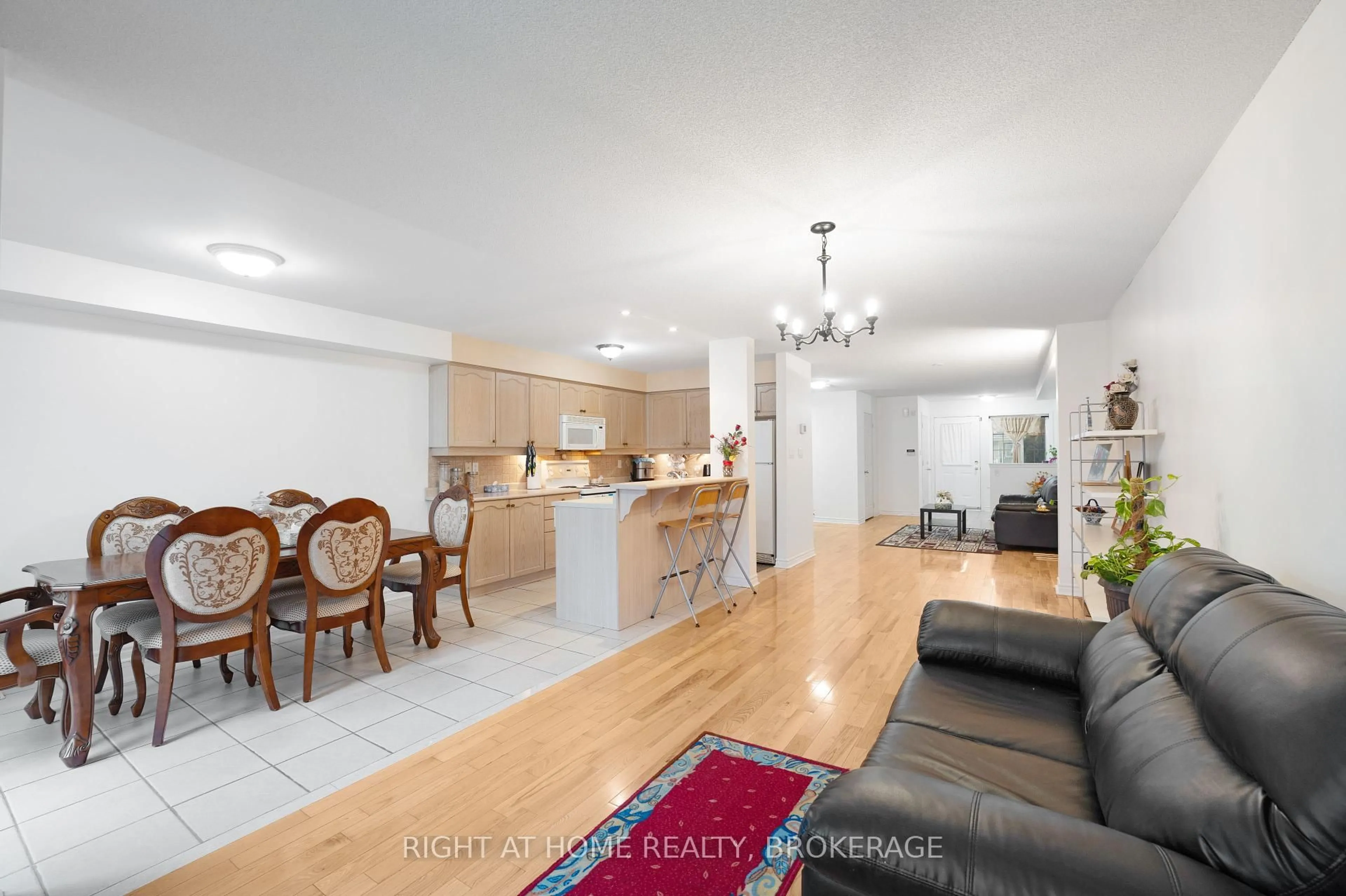 Open concept kitchen, wood/laminate floor for 1528 Avonmore Sq, Pickering Ontario L1V 7H3