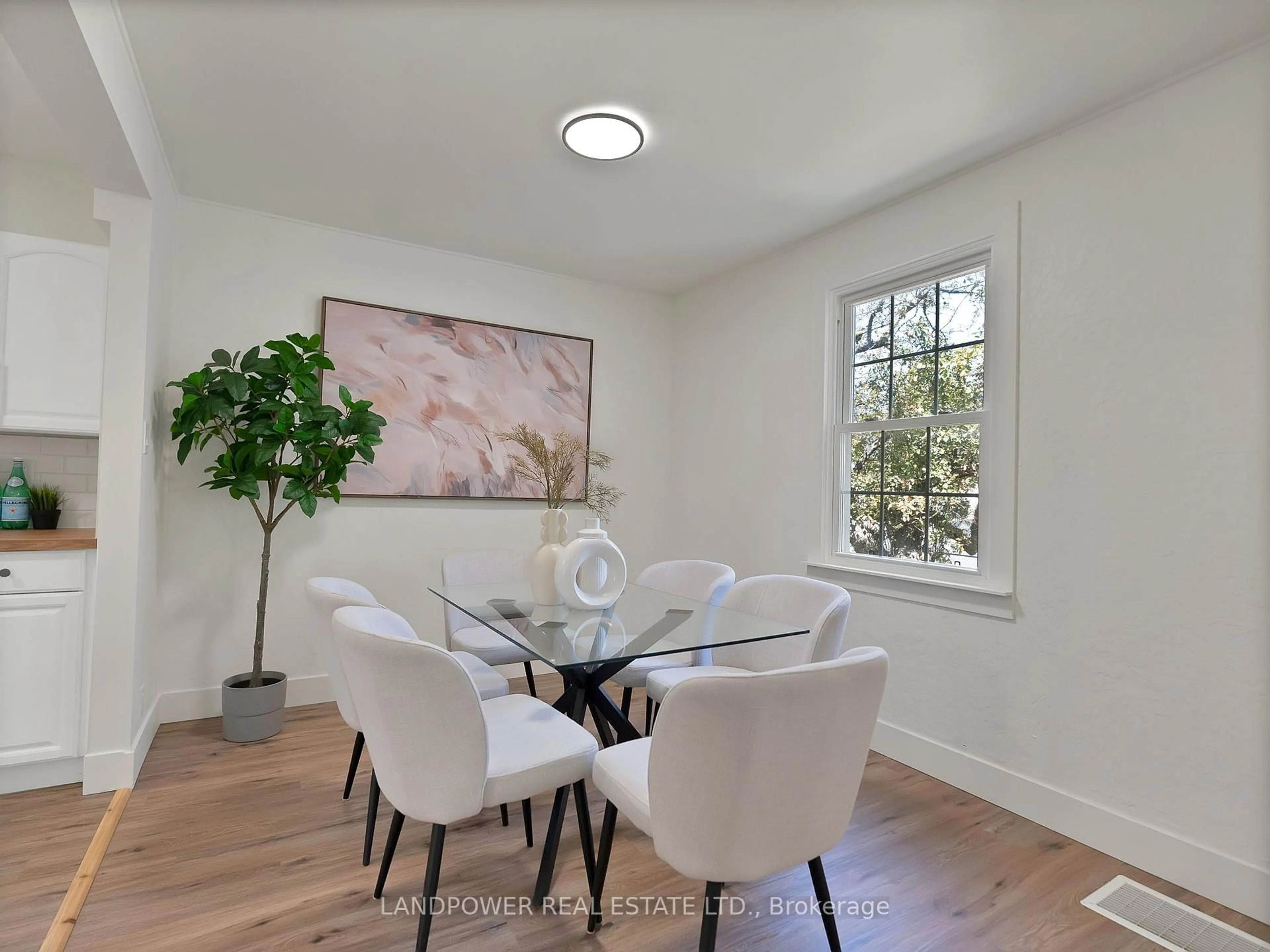 Dining room, wood/laminate floor for 596 Pharmacy Ave, Toronto Ontario M1L 3G9