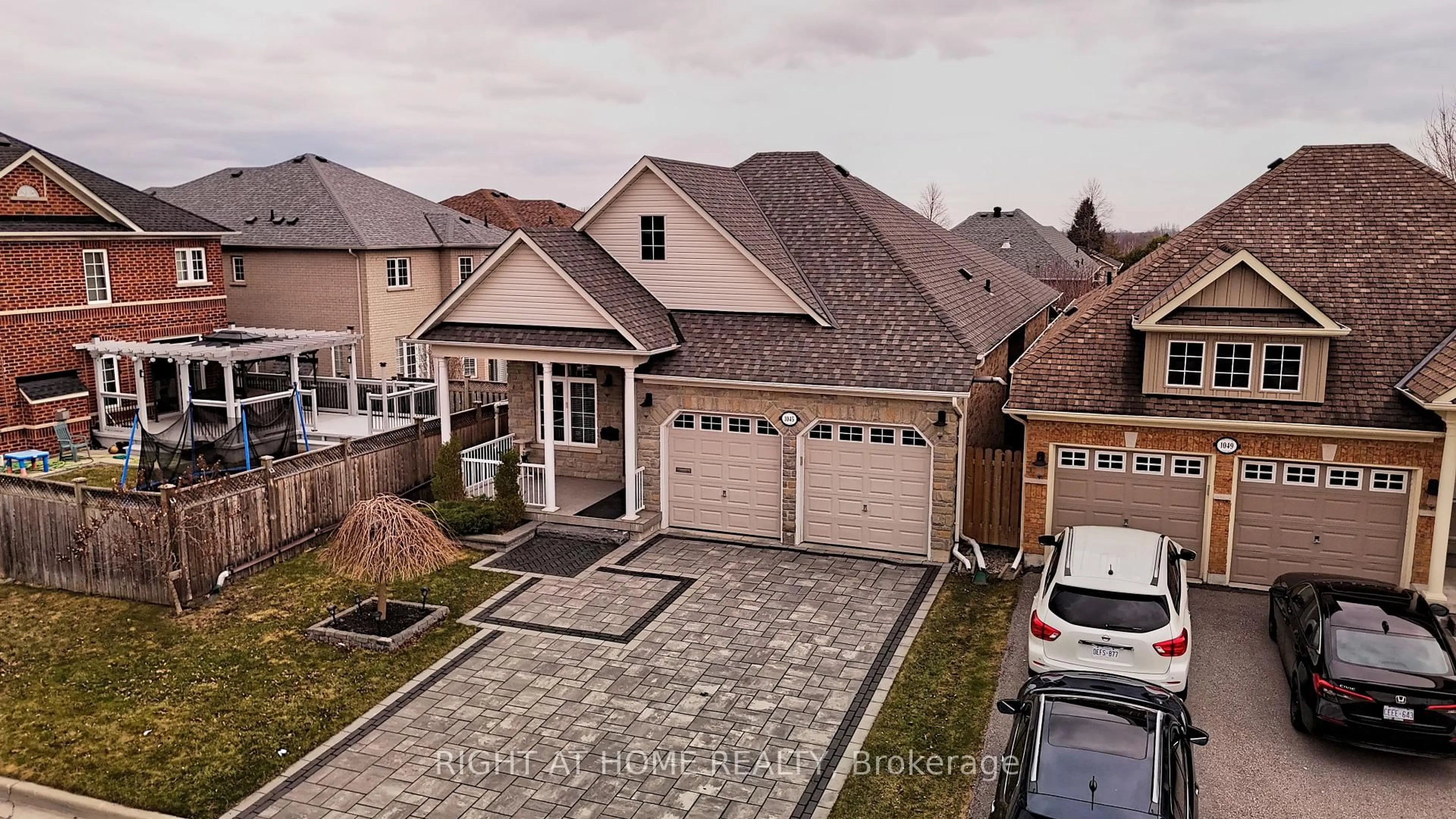 A pic from outside/outdoor area/front of a property/back of a property/a pic from drone, street for 1045 Coyston Crt, Oshawa Ontario L1K 3C4