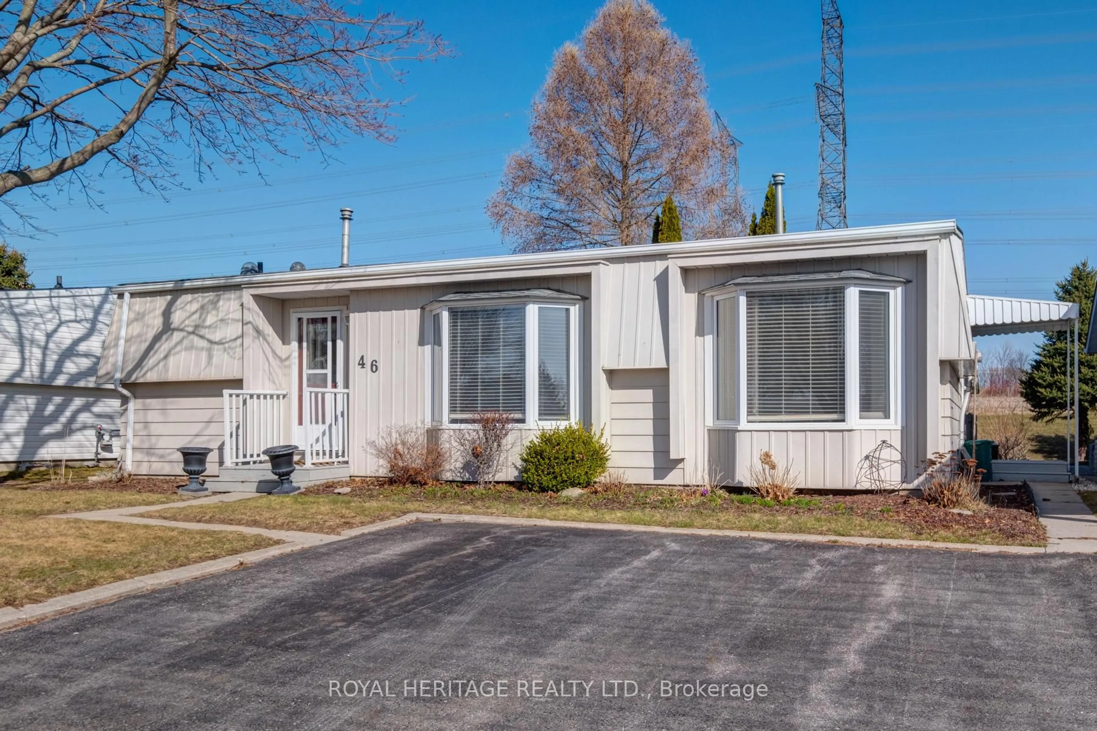 Home with vinyl exterior material, street for 46 Wilmot Tr, Clarington Ontario L1B 1B8