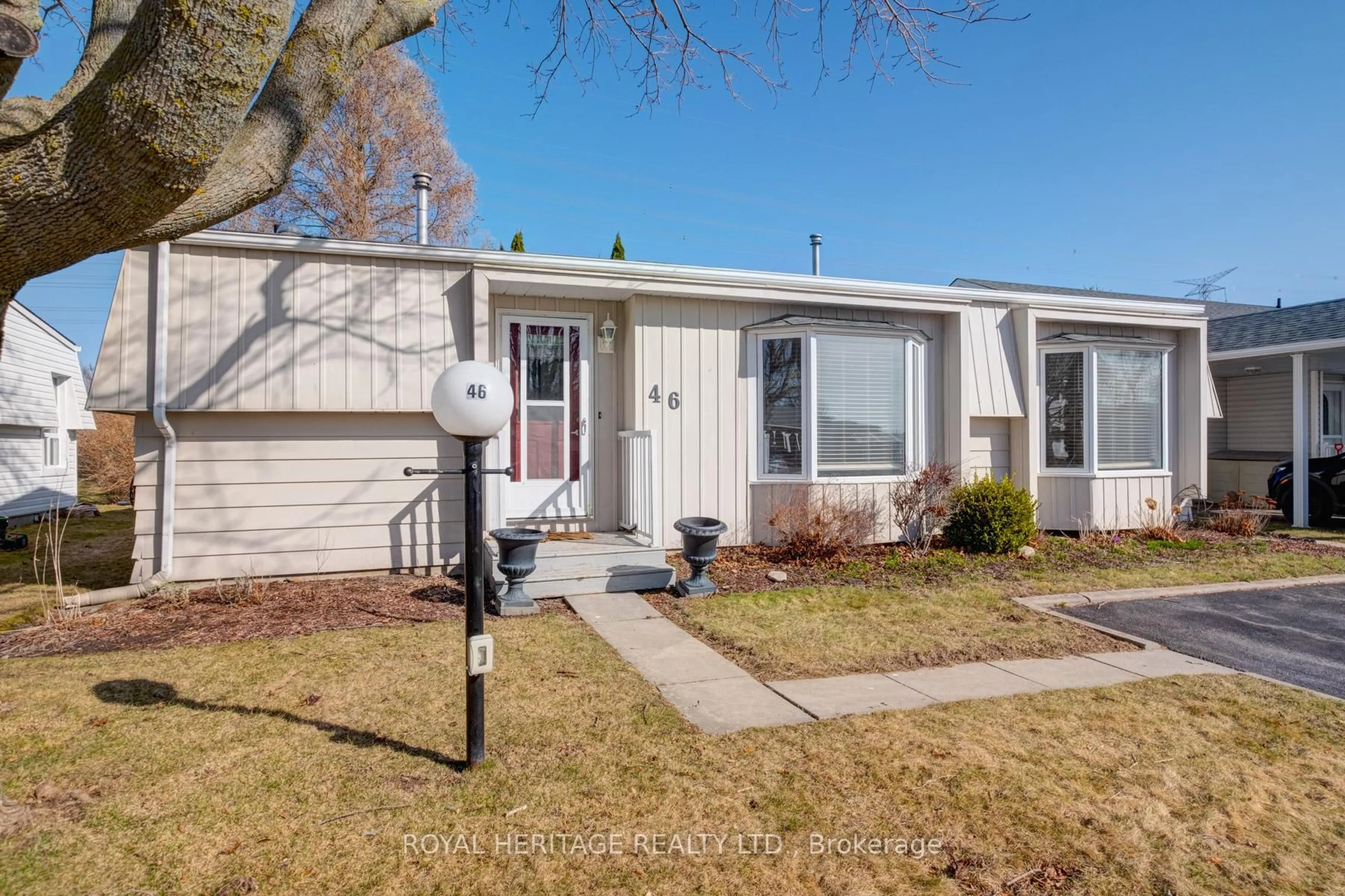 Home with vinyl exterior material, street for 46 Wilmot Tr, Clarington Ontario L1B 1B8