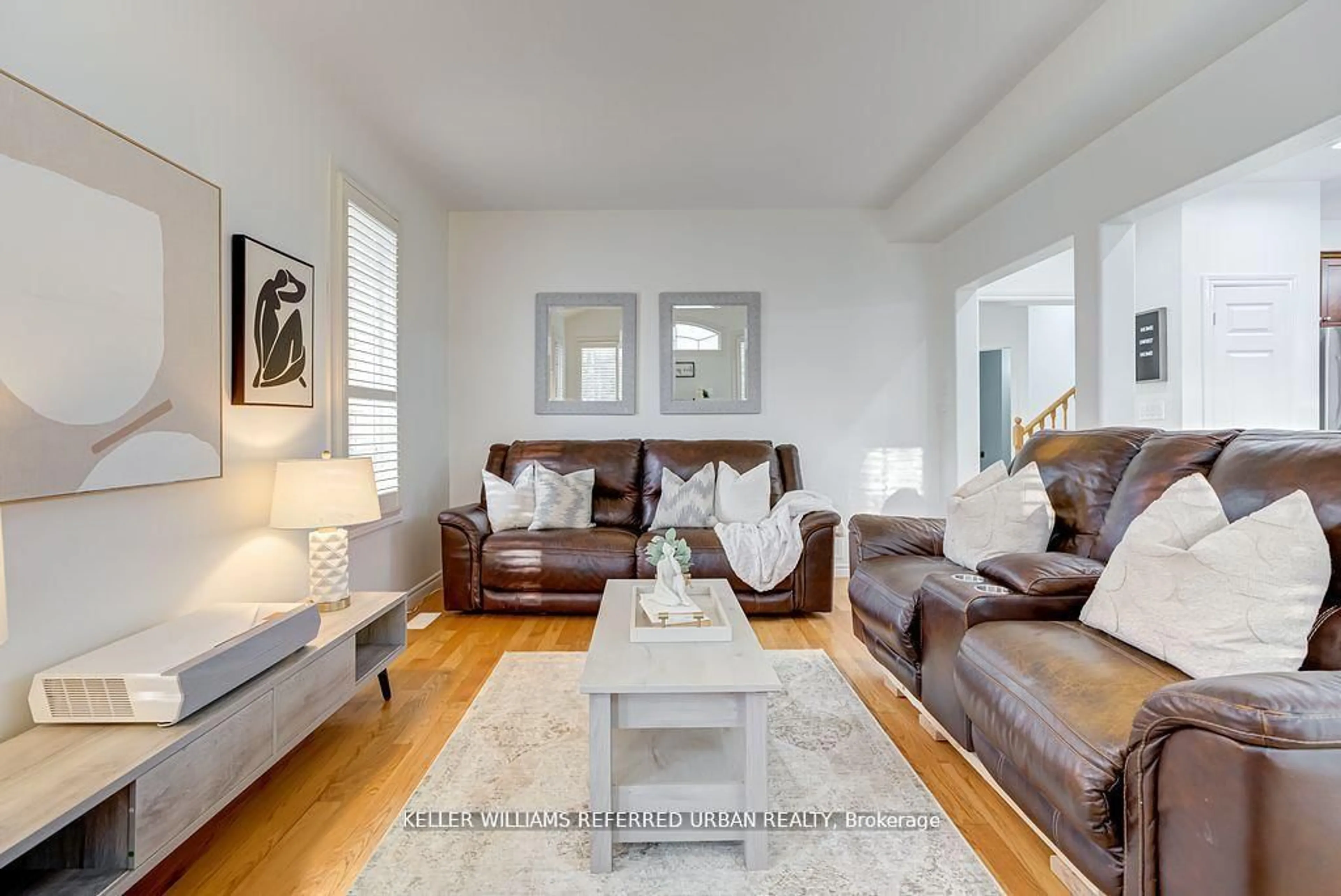 Living room with furniture, wood/laminate floor for 2 Thistledown Cres, Whitby Ontario L1R 3P2