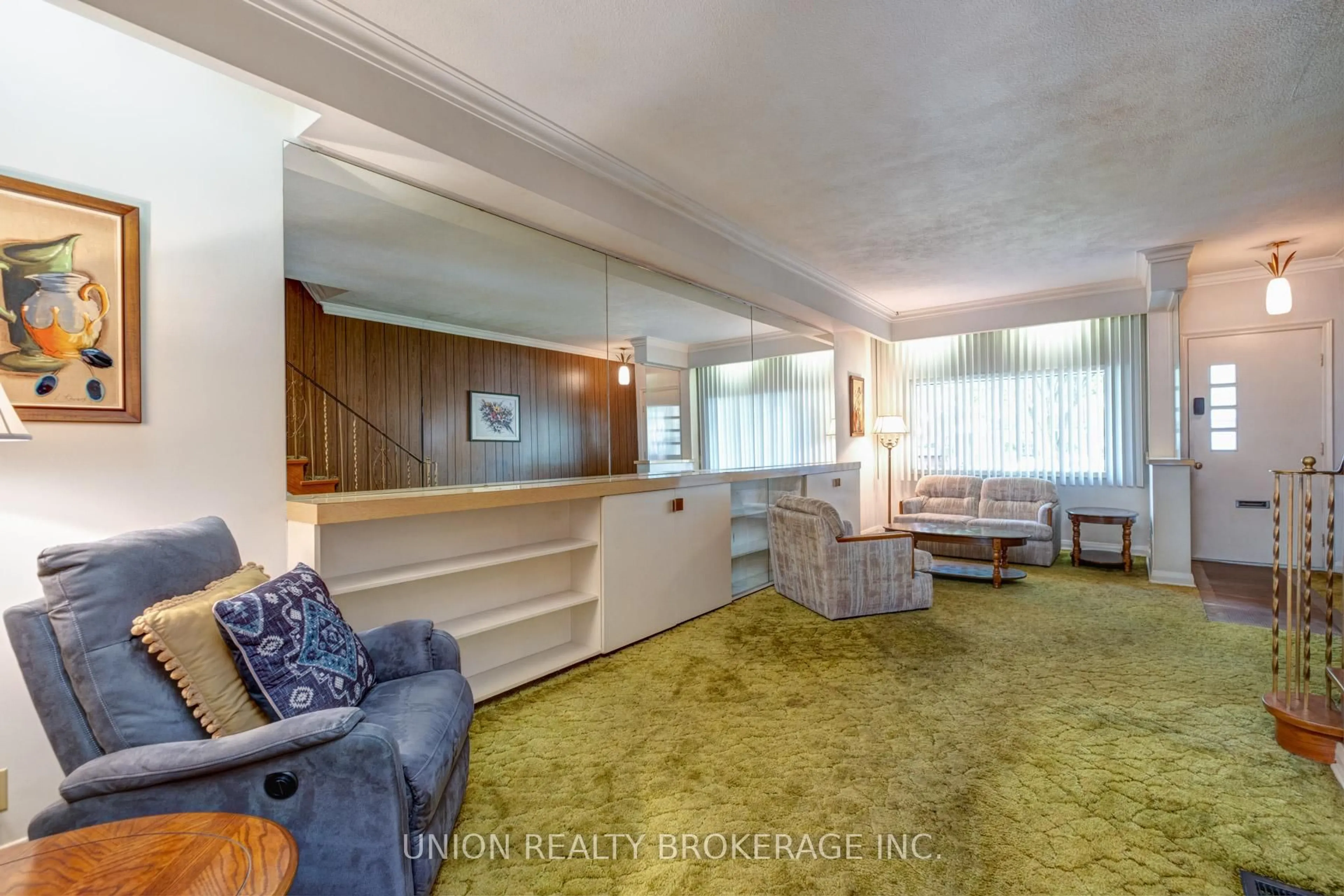 Living room with furniture, carpet floor for 313 Kenilworth Ave, Toronto Ontario M4L 3S9