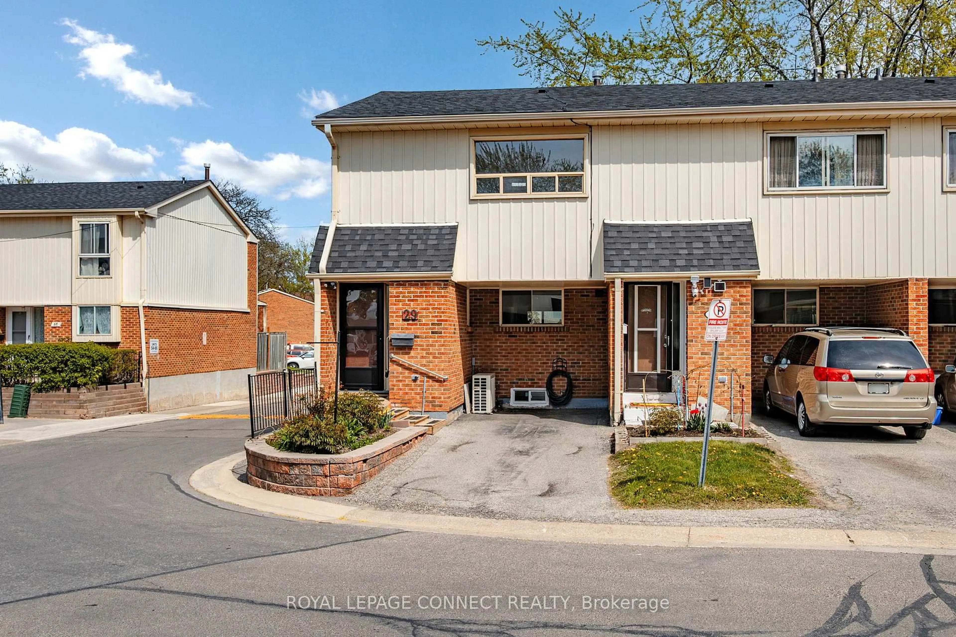 Home with brick exterior material, street for 2451 Bridletowne Circ #29, Toronto Ontario M1W 2Y4