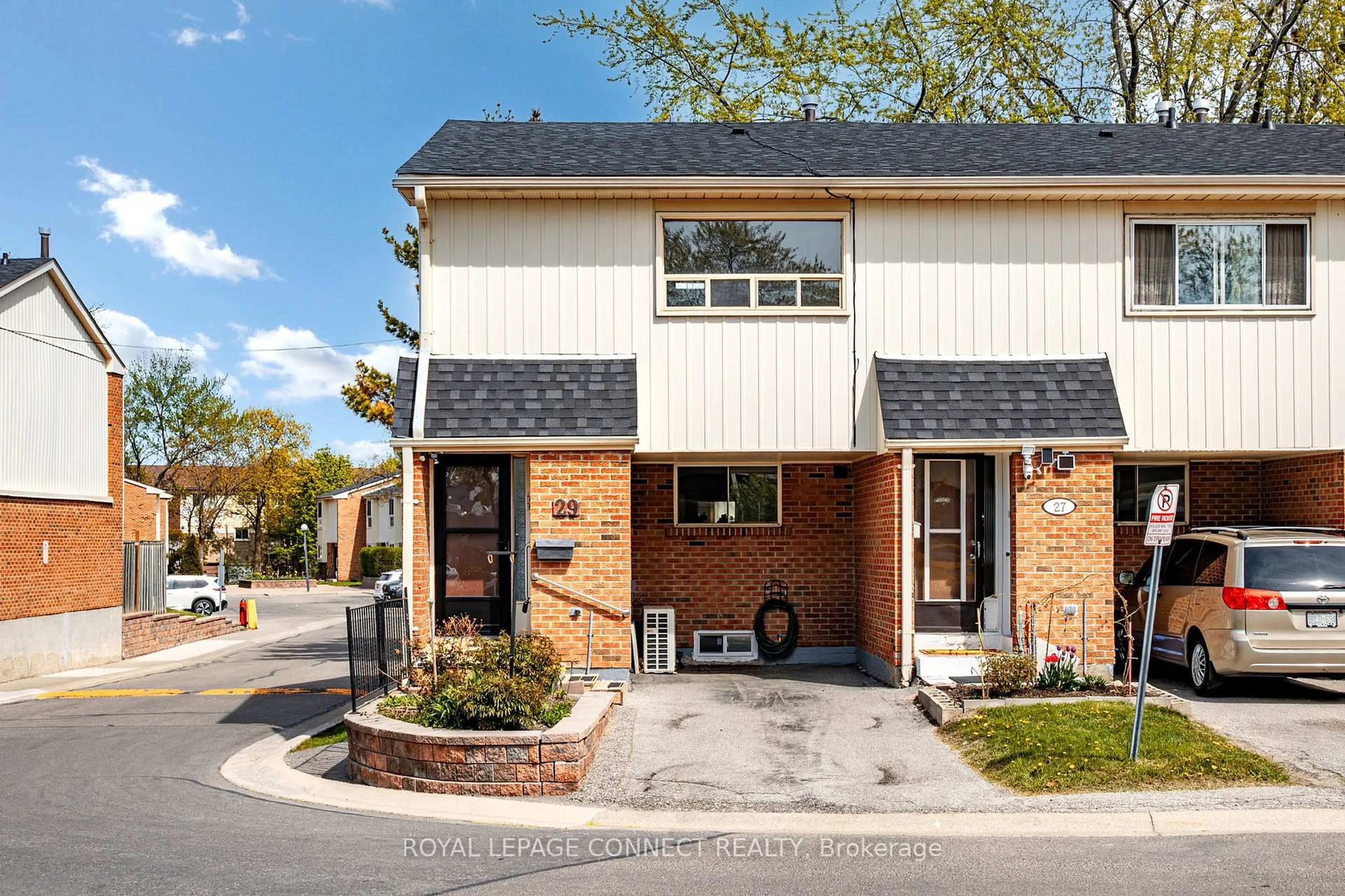 Home with brick exterior material, street for 2451 Bridletowne Circ #29, Toronto Ontario M1W 2Y4