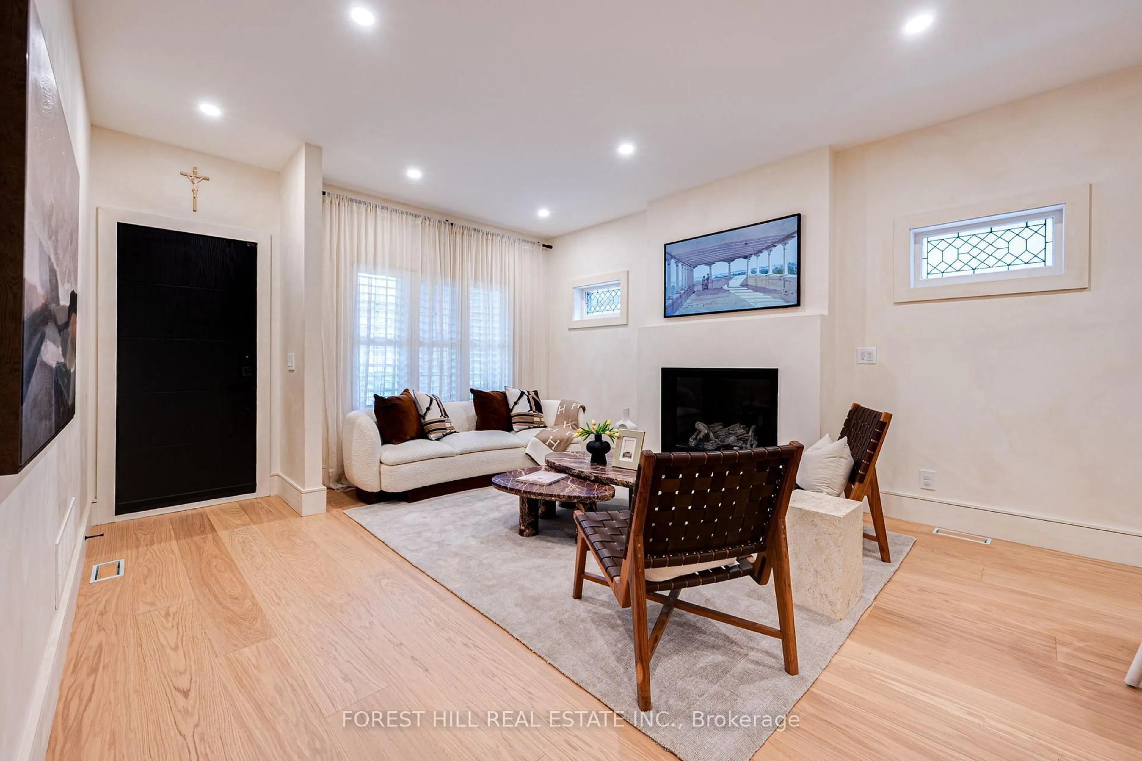 Living room with furniture, wood/laminate floor for 295 Strathmore Blvd, Toronto Ontario M4J 1P9