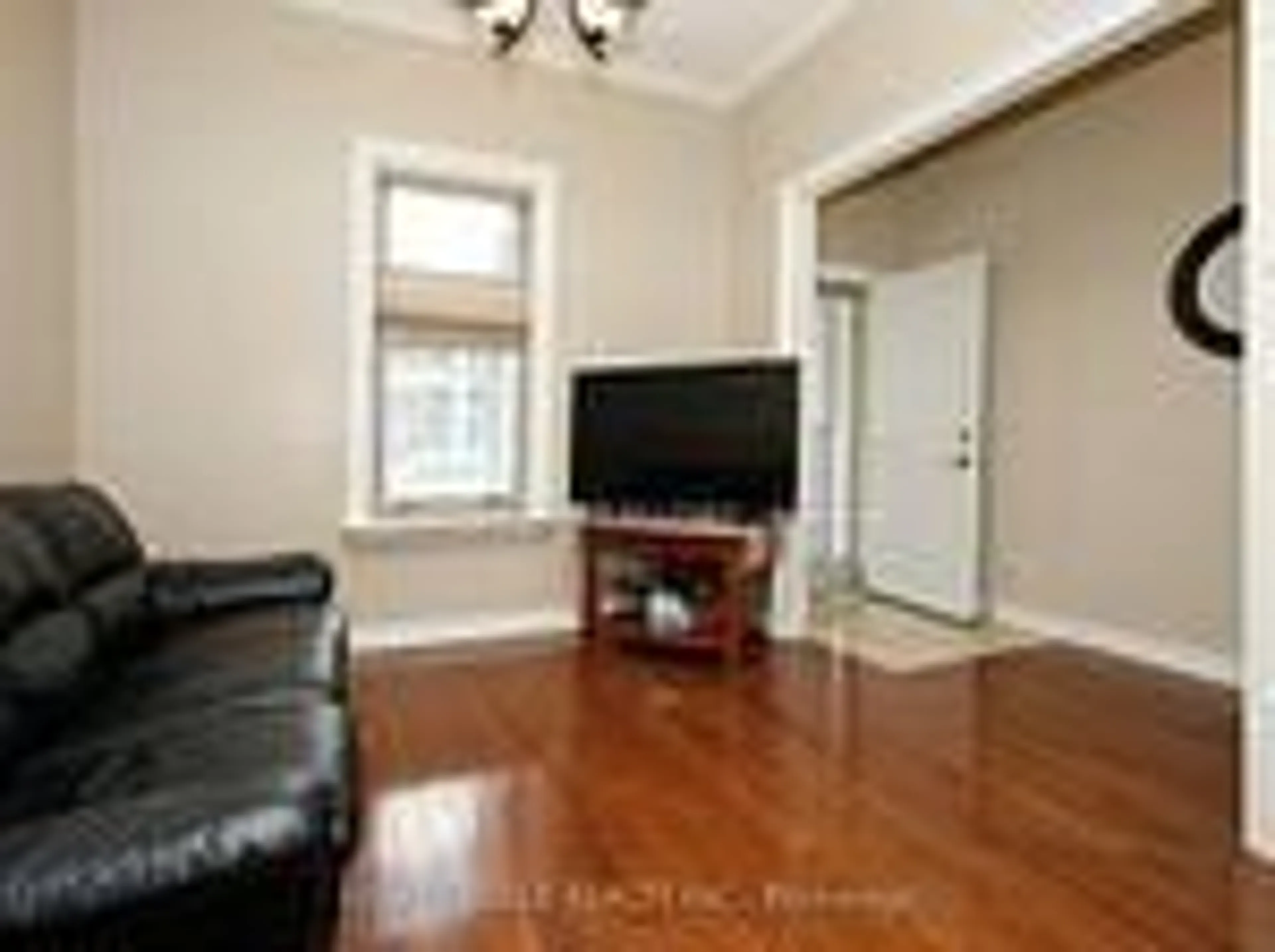 Living room with furniture, wood/laminate floor for 106 Carlaw Ave, Toronto Ontario M4M 2R7