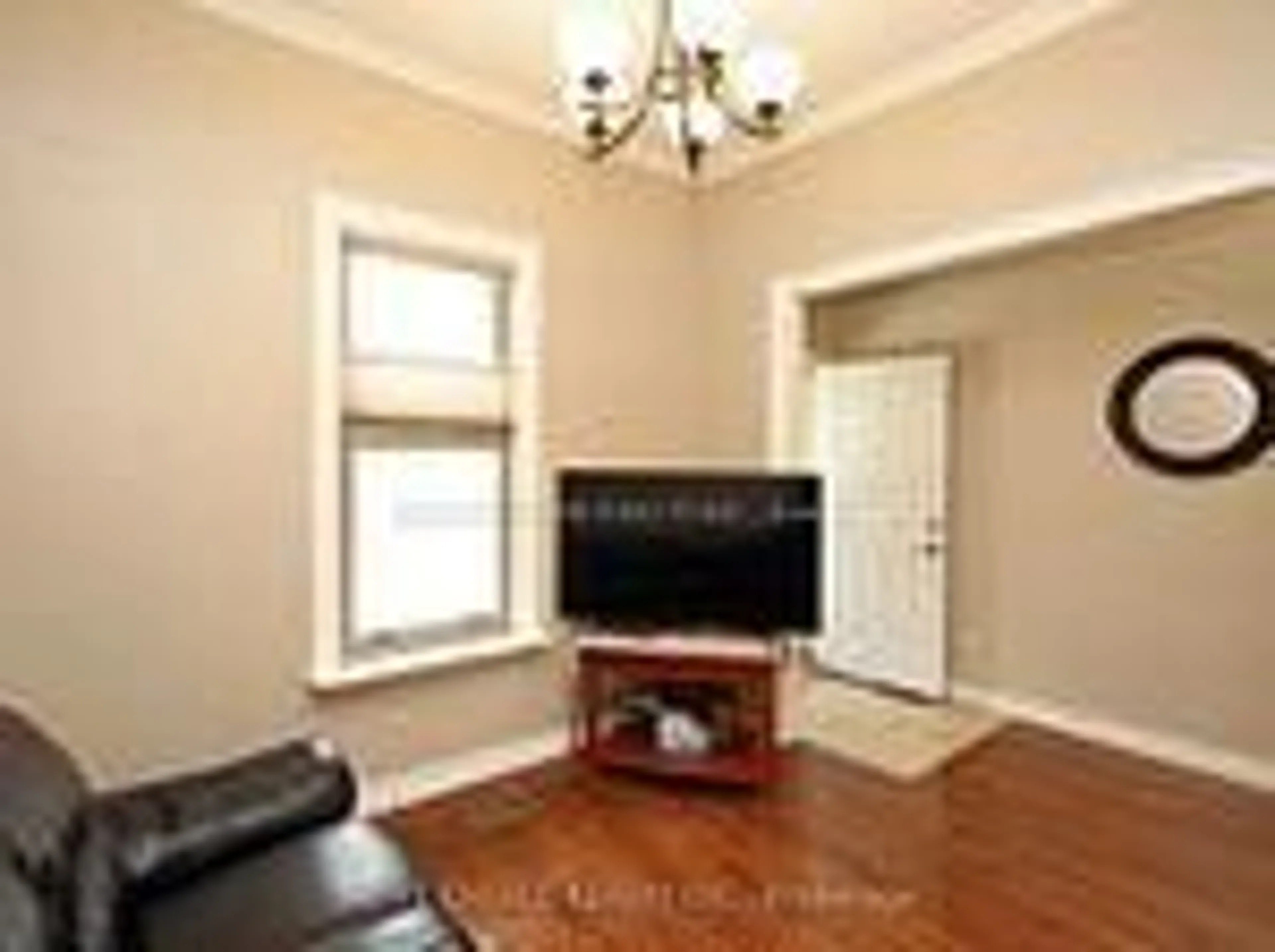Living room with furniture, wood/laminate floor for 106 Carlaw Ave, Toronto Ontario M4M 2R7