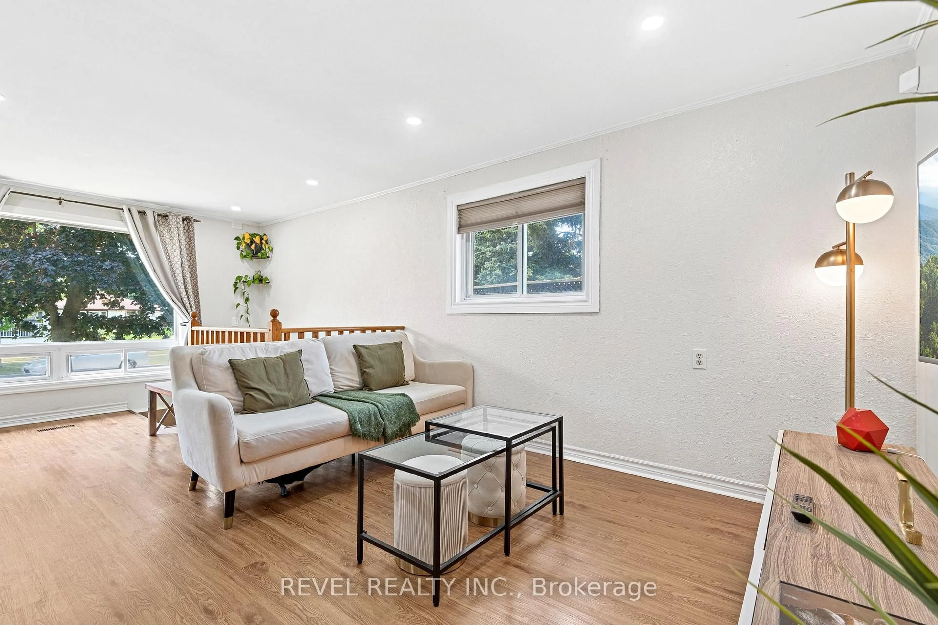 Living room with furniture, wood/laminate floor for 1132 Norman Cres, Oshawa Ontario L1H 7X1