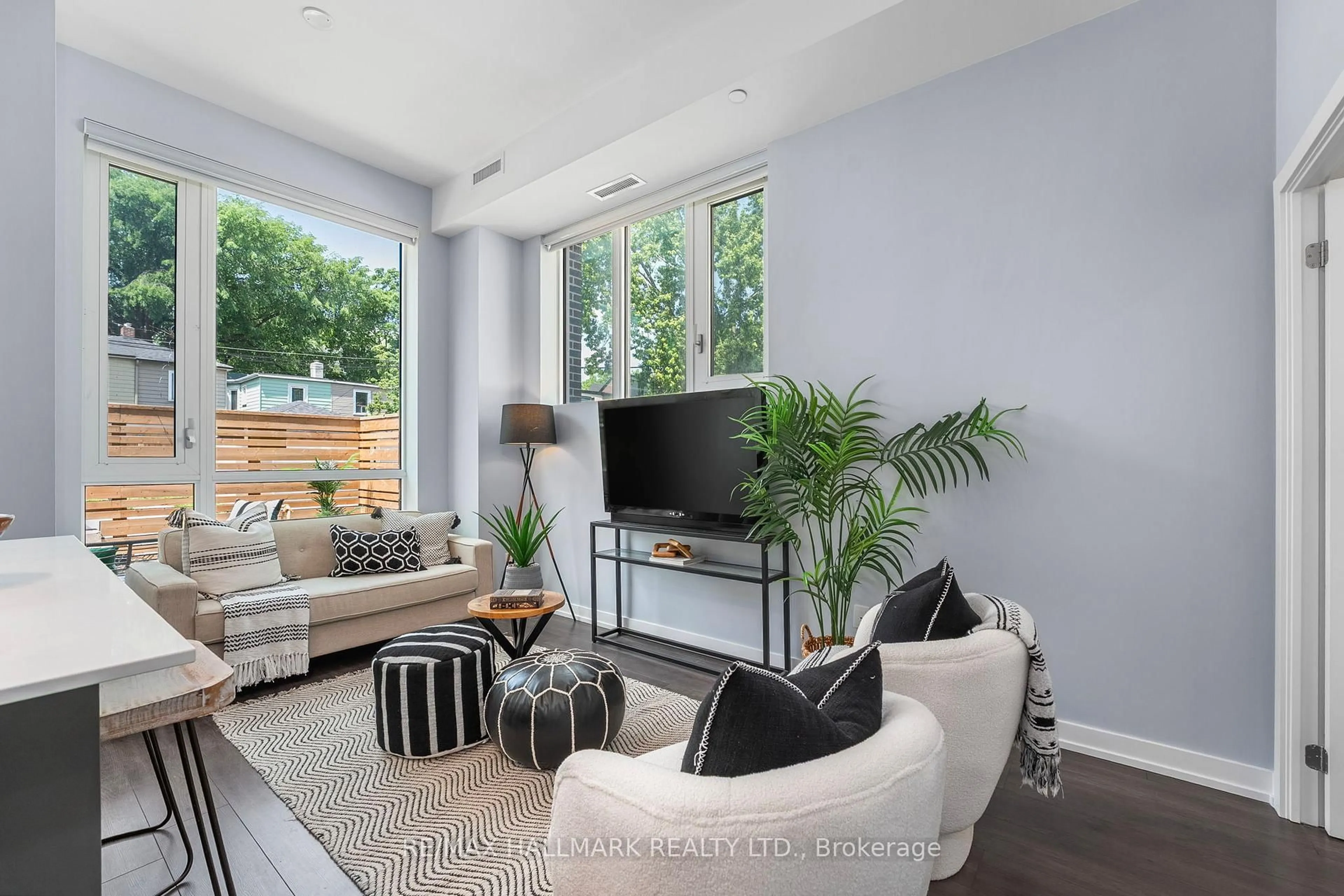 Living room with furniture, unknown for 150 Logan Ave #124, Toronto Ontario M4M 0E4