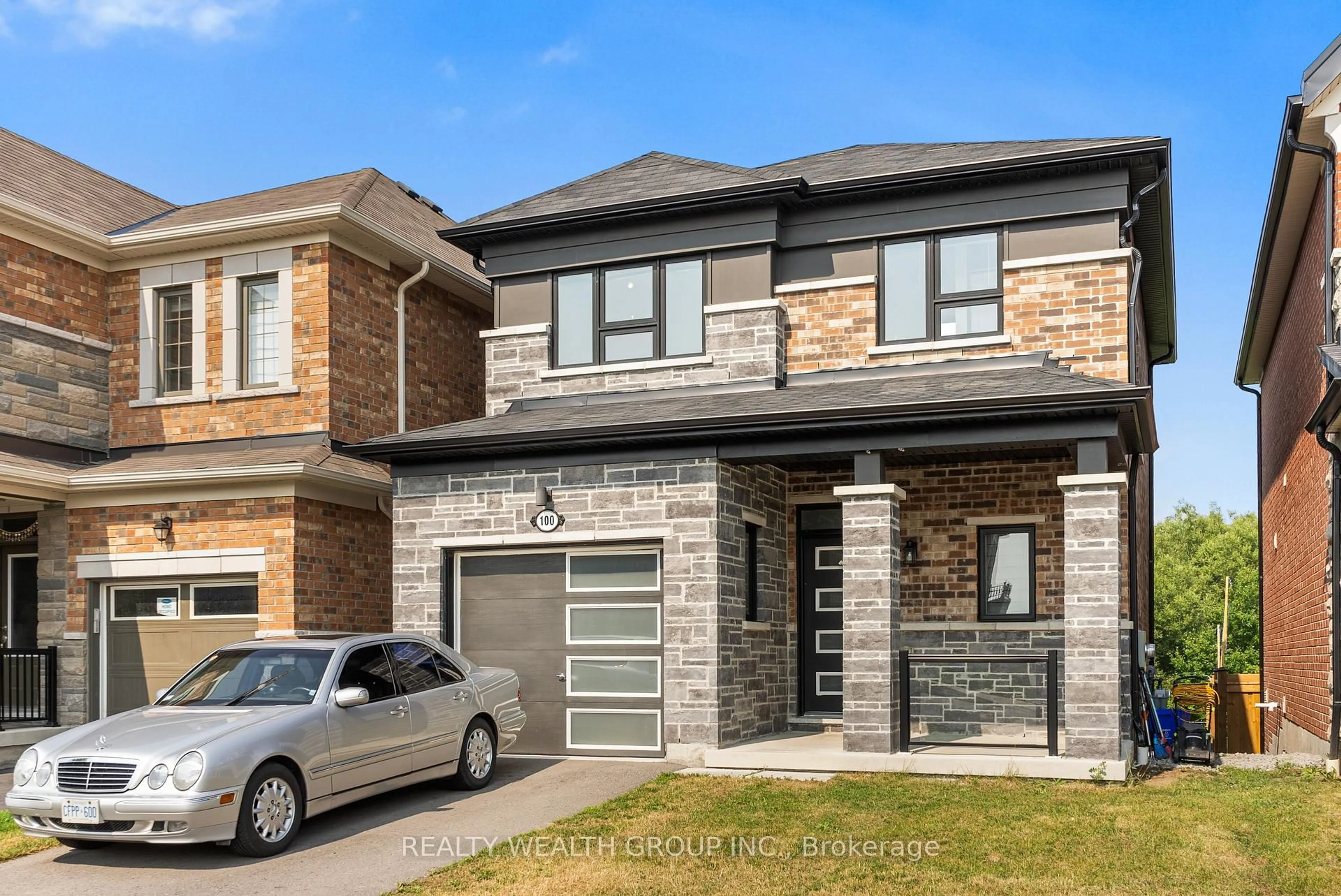 Home with brick exterior material, street for 100 BARKERVILLE Dr, Whitby Ontario L1P 0L8