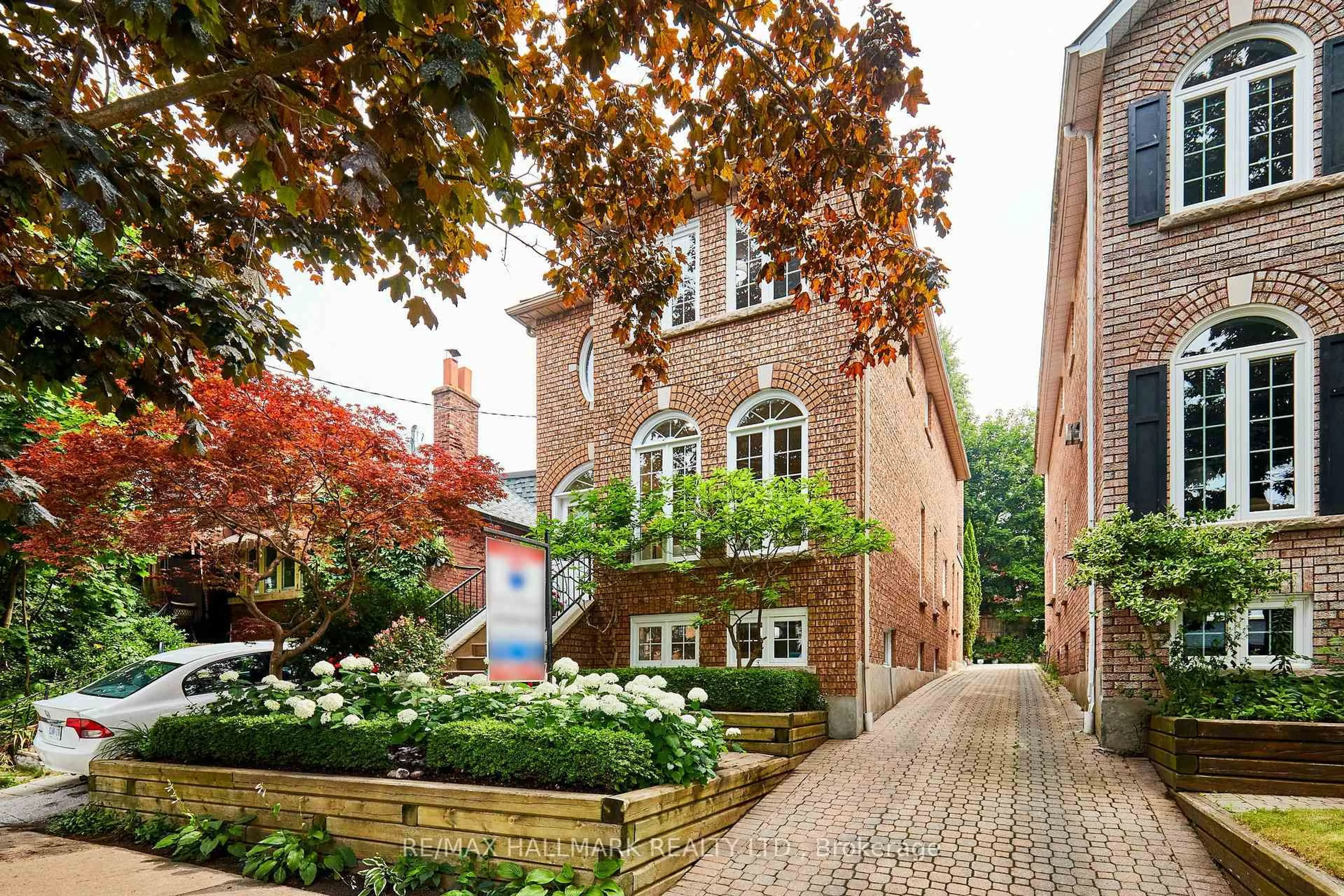 Home with brick exterior material, street for 103A Maclean Ave, Toronto Ontario M4E 2Z8