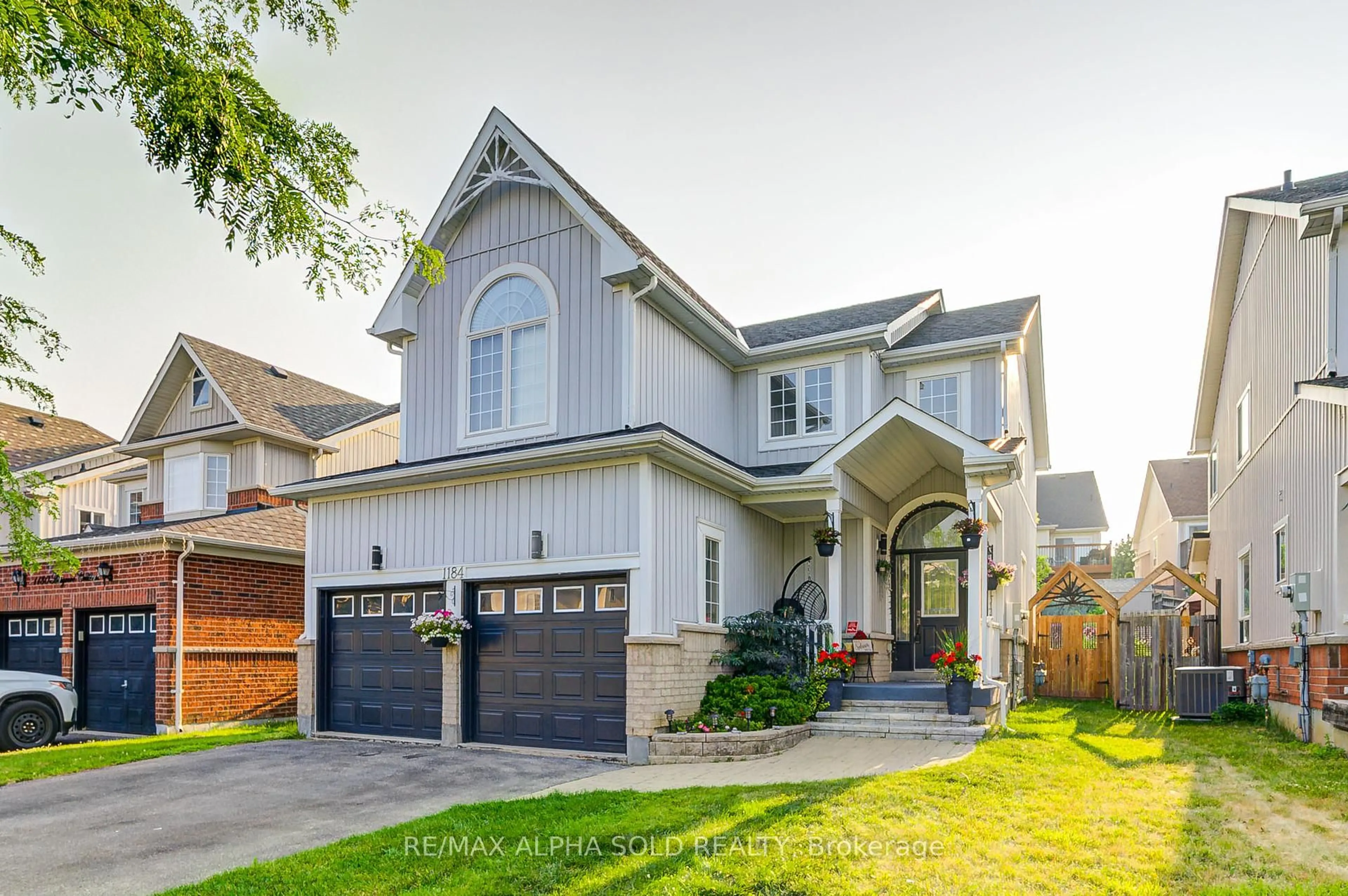 Home with brick exterior material, street for 1184 Ashgrove Cres, Oshawa Ontario L1K 3A4