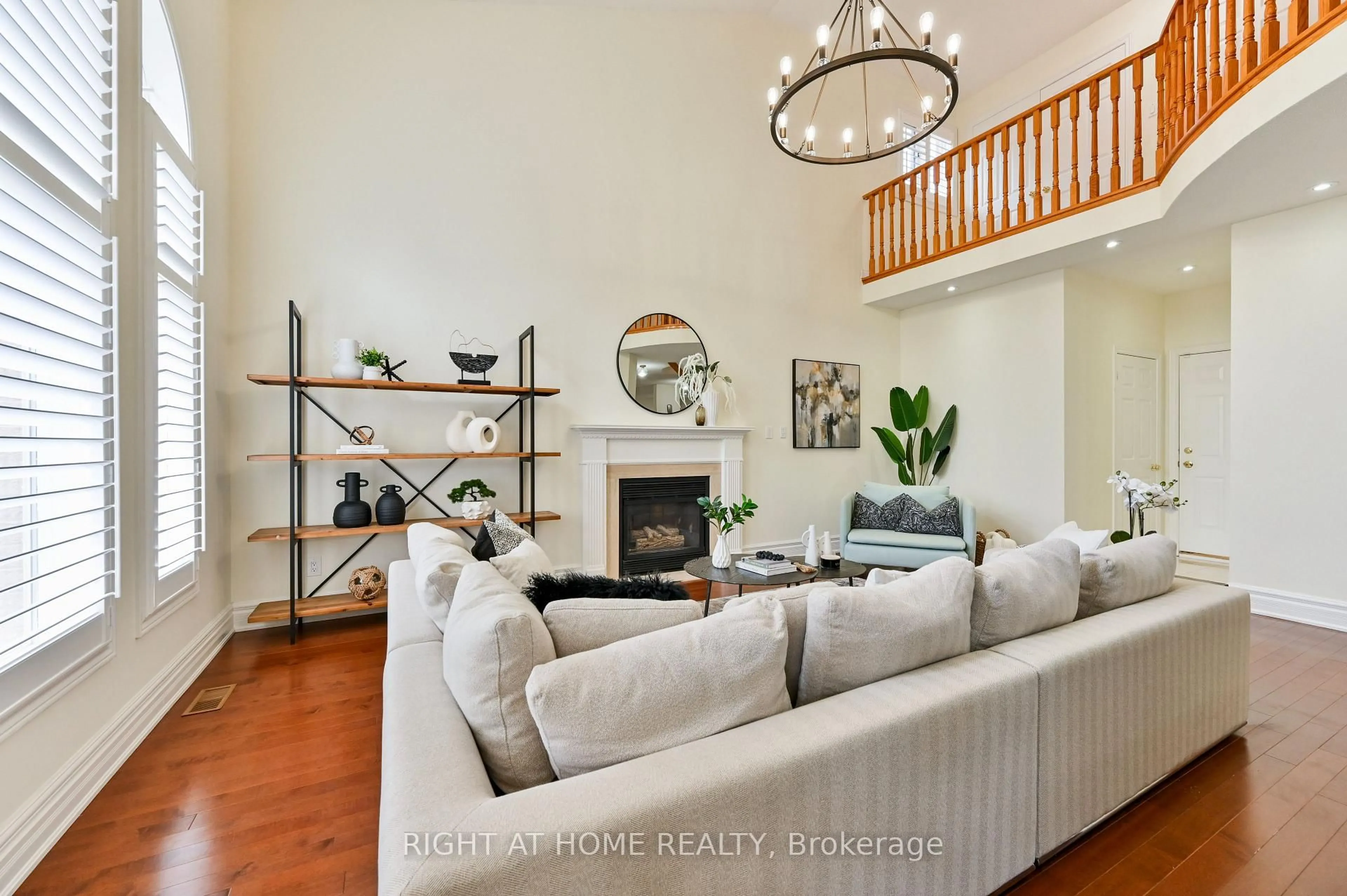 Living room with furniture, wood/laminate floor for 842 Primrose Crt, Pickering Ontario L1X 2S7