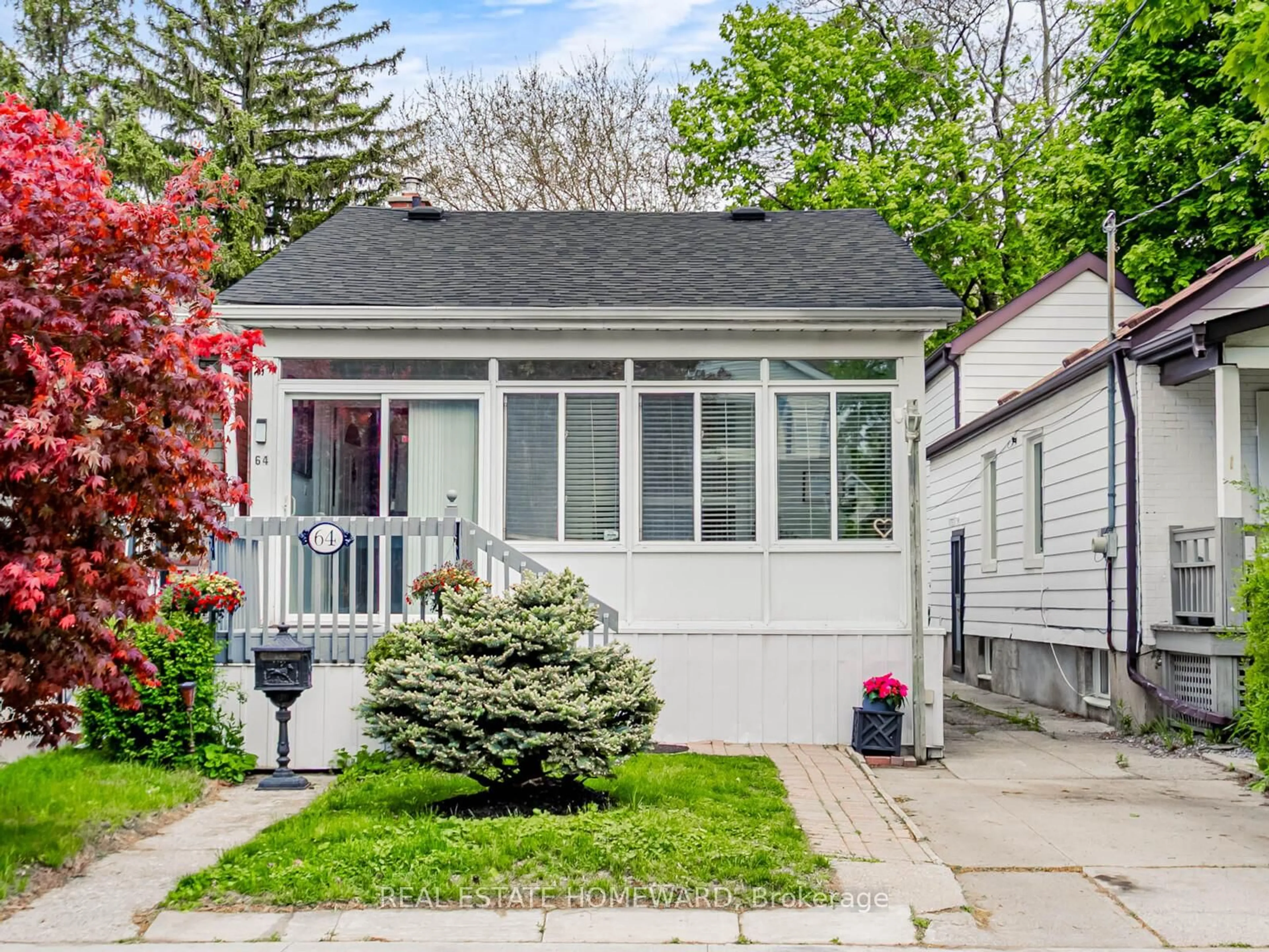 Home with vinyl exterior material, street for 64 Frater Ave, Toronto Ontario M4C 2H6