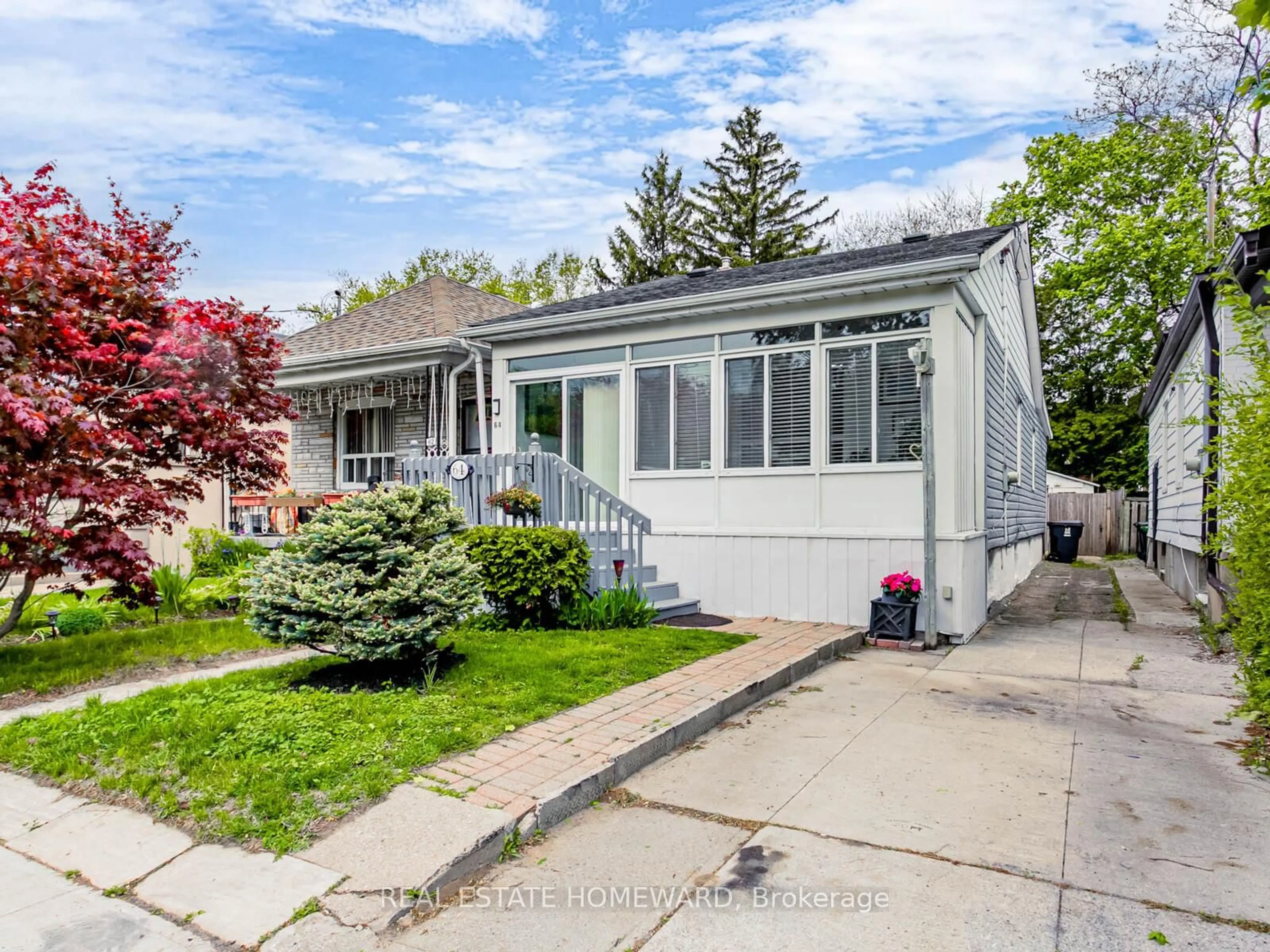 Home with vinyl exterior material, street for 64 Frater Ave, Toronto Ontario M4C 2H6