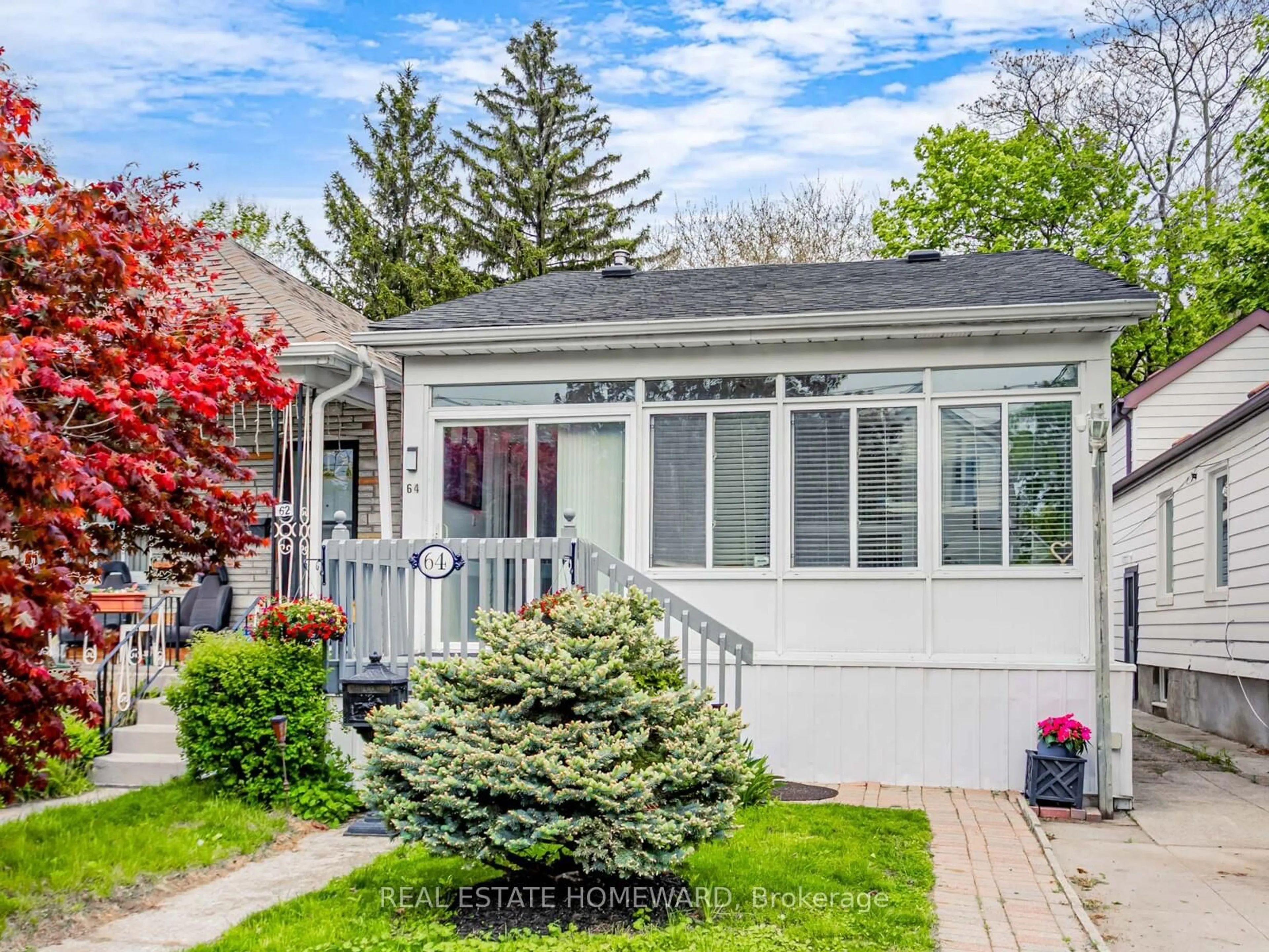 Home with vinyl exterior material, street for 64 Frater Ave, Toronto Ontario M4C 2H6