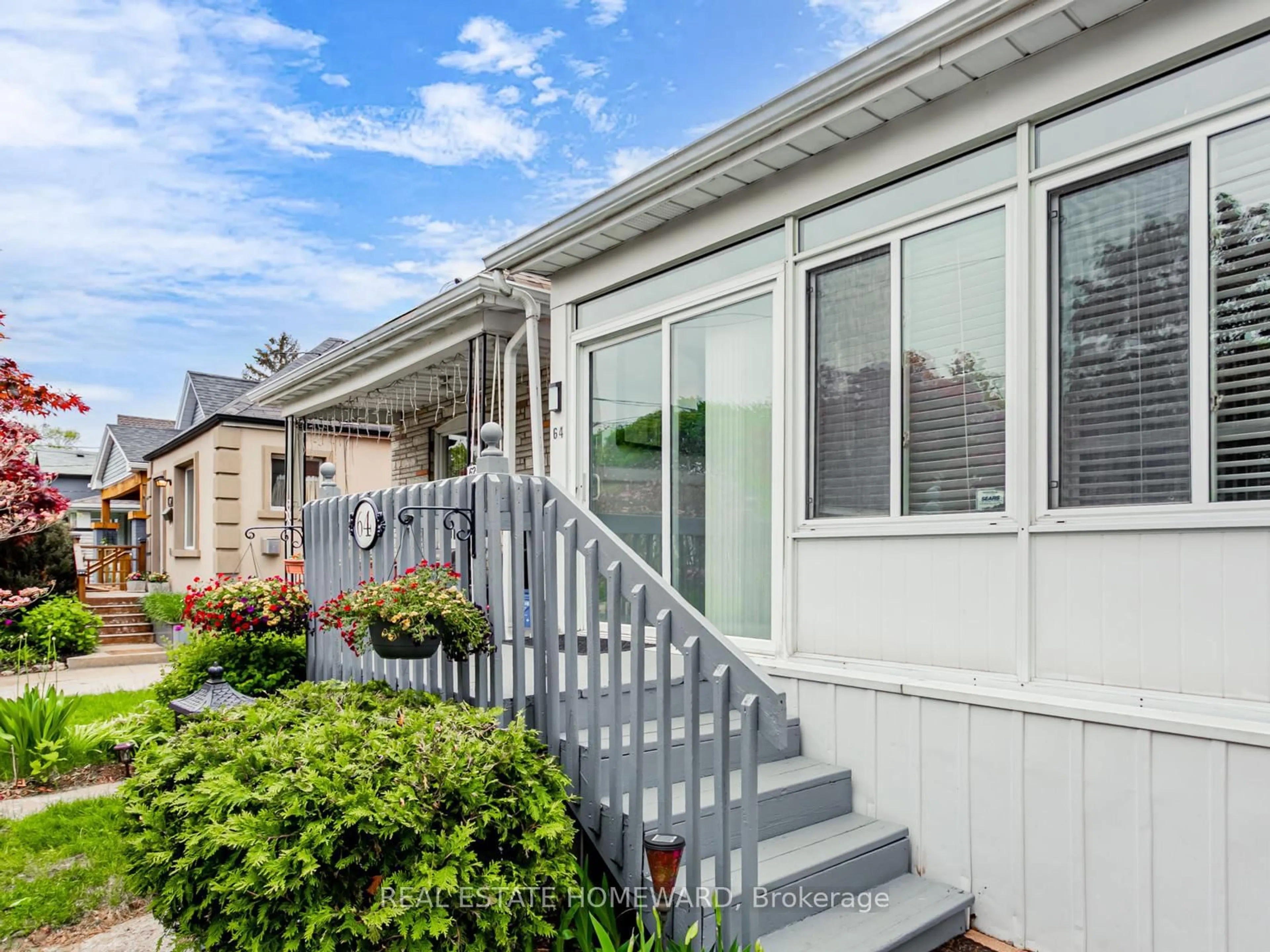 Home with vinyl exterior material, street for 64 Frater Ave, Toronto Ontario M4C 2H6
