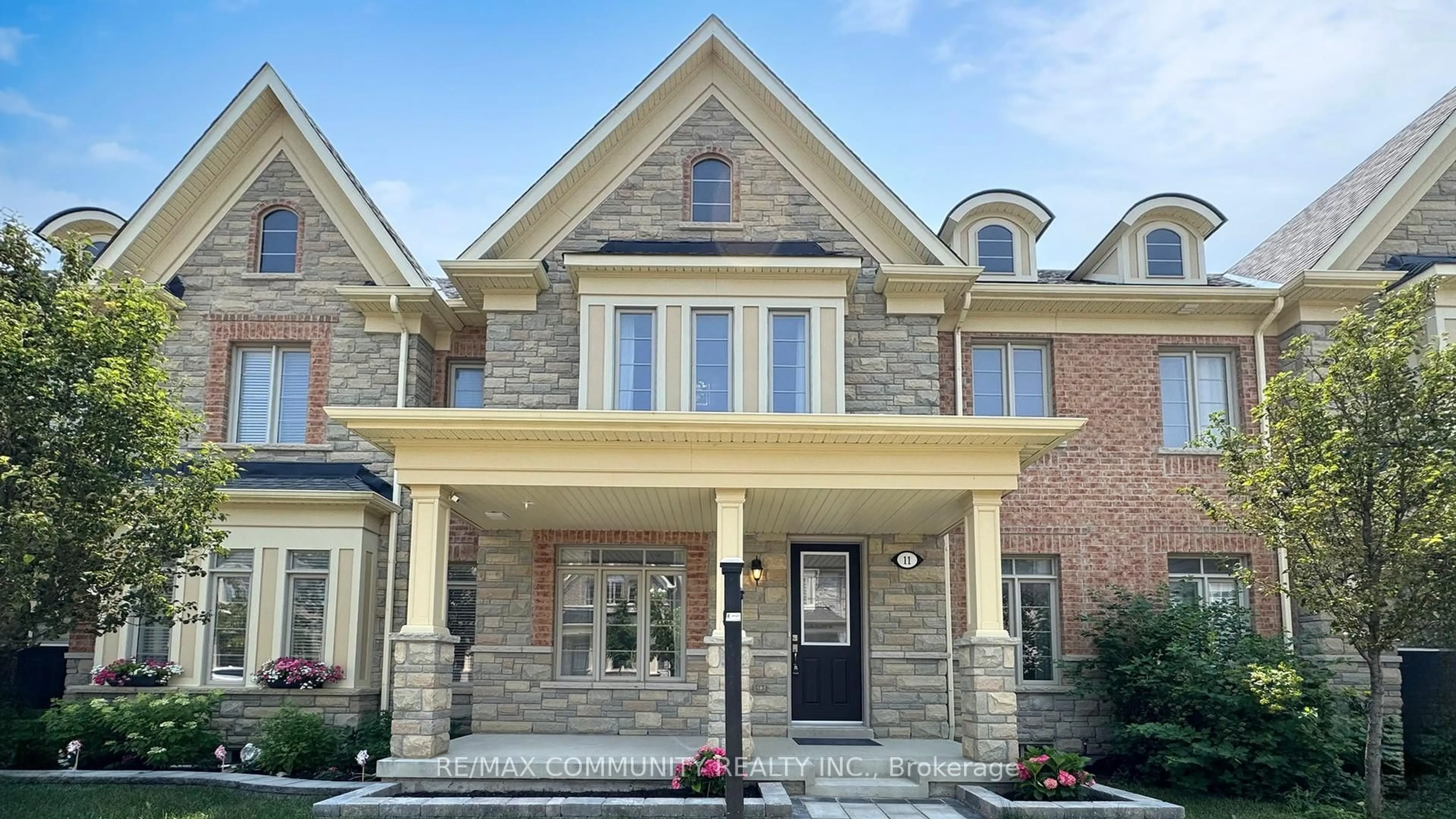 Home with brick exterior material, street for 11 Clutterbuck Lane, Ajax Ontario L1T 0N6