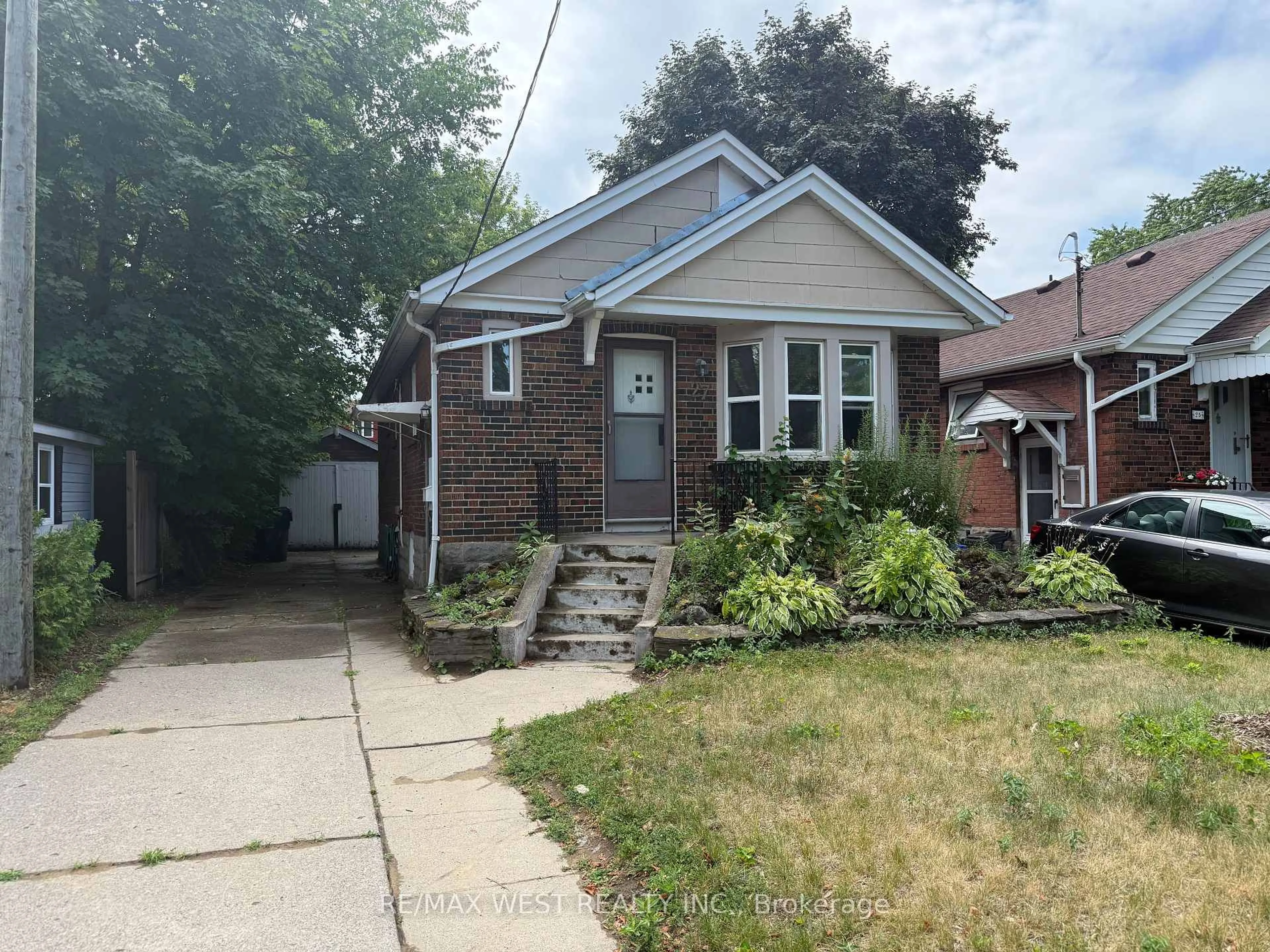 Home with brick exterior material, street for 27 Frater Ave, Toronto Ontario M4C 2H3