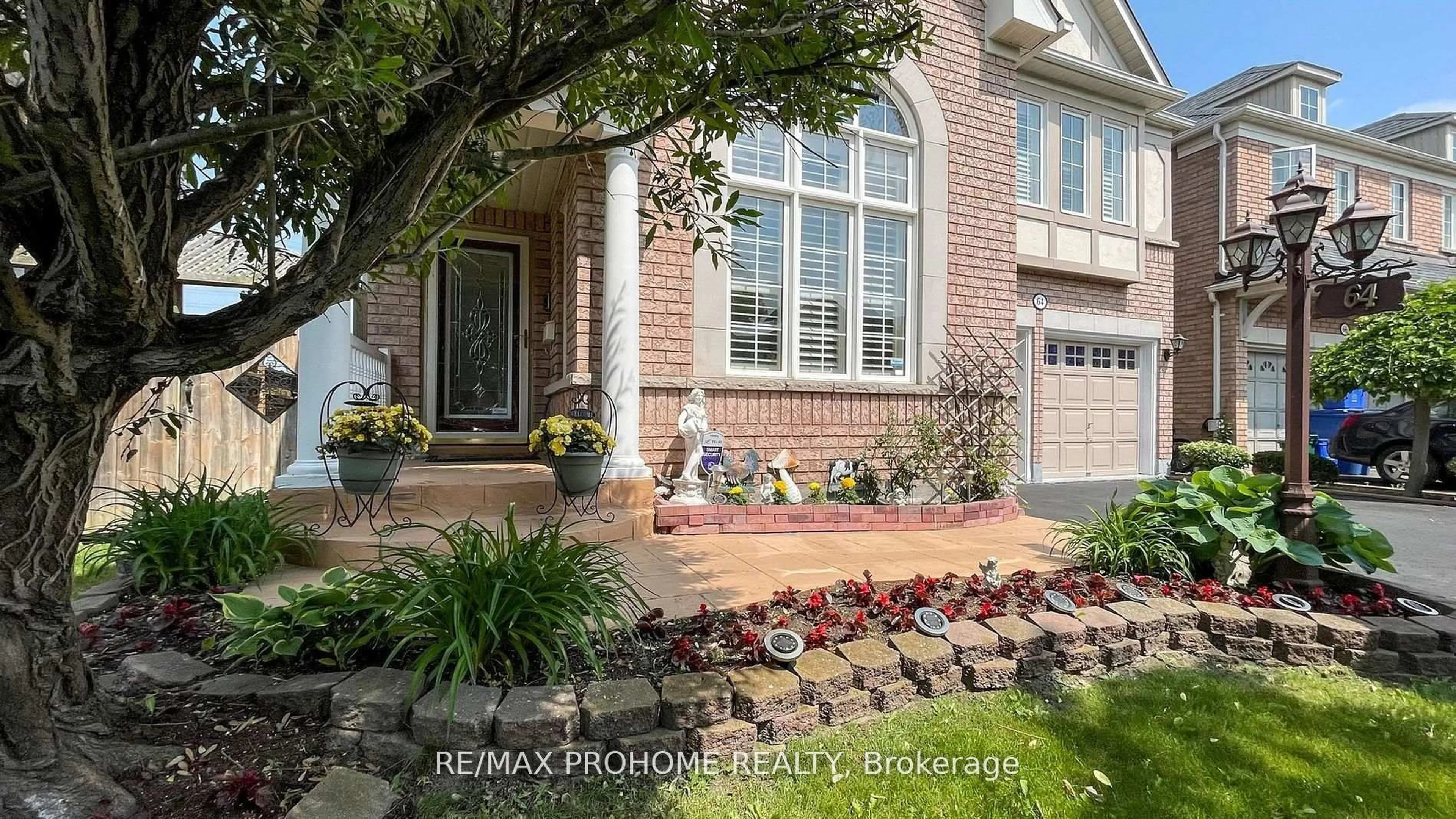 Home with brick exterior material, street for 64 Grainger Cres, Ajax Ontario L1T 4Y6