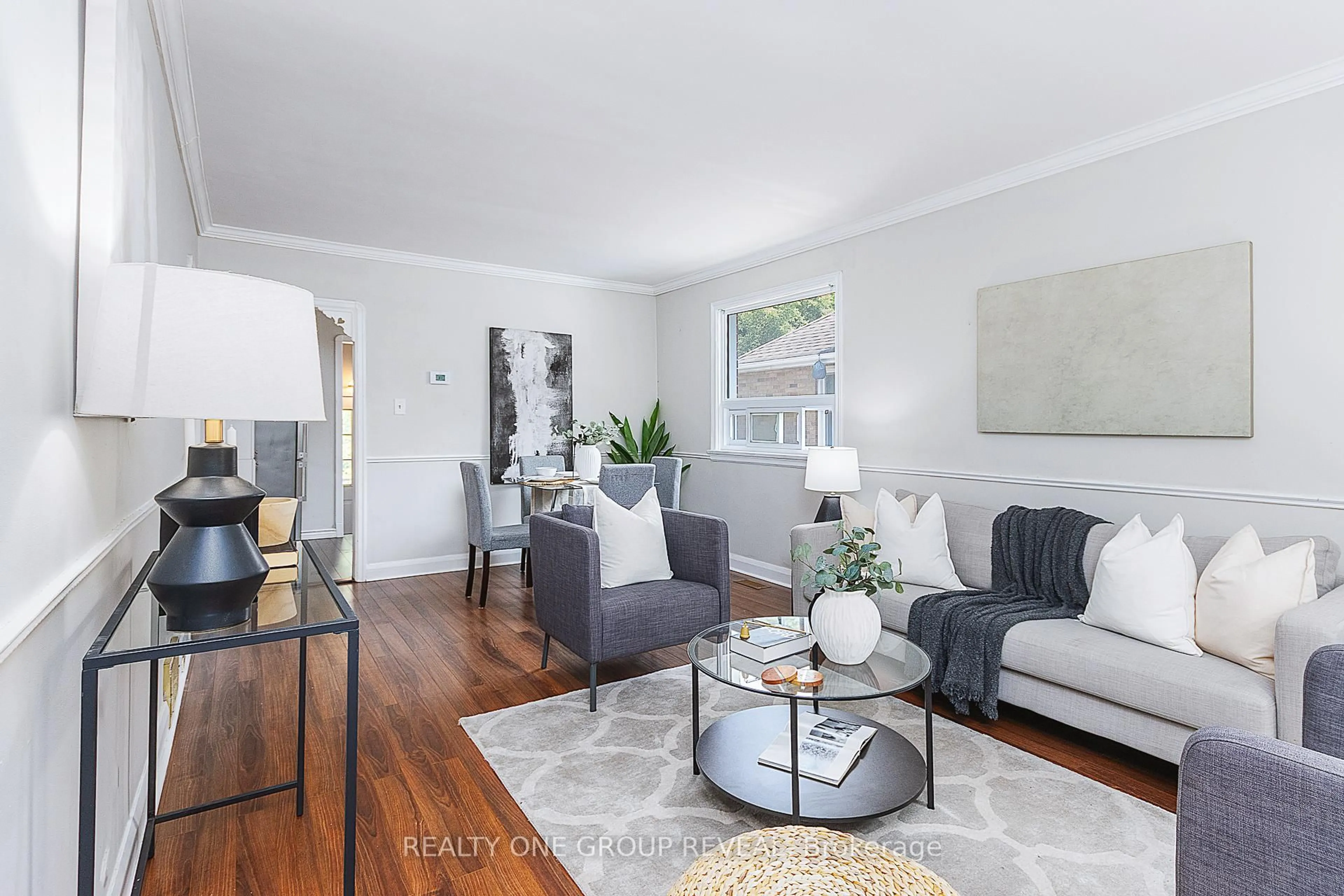 Living room with furniture, wood/laminate floor for 629 Grierson St, Oshawa Ontario L1G 5J3