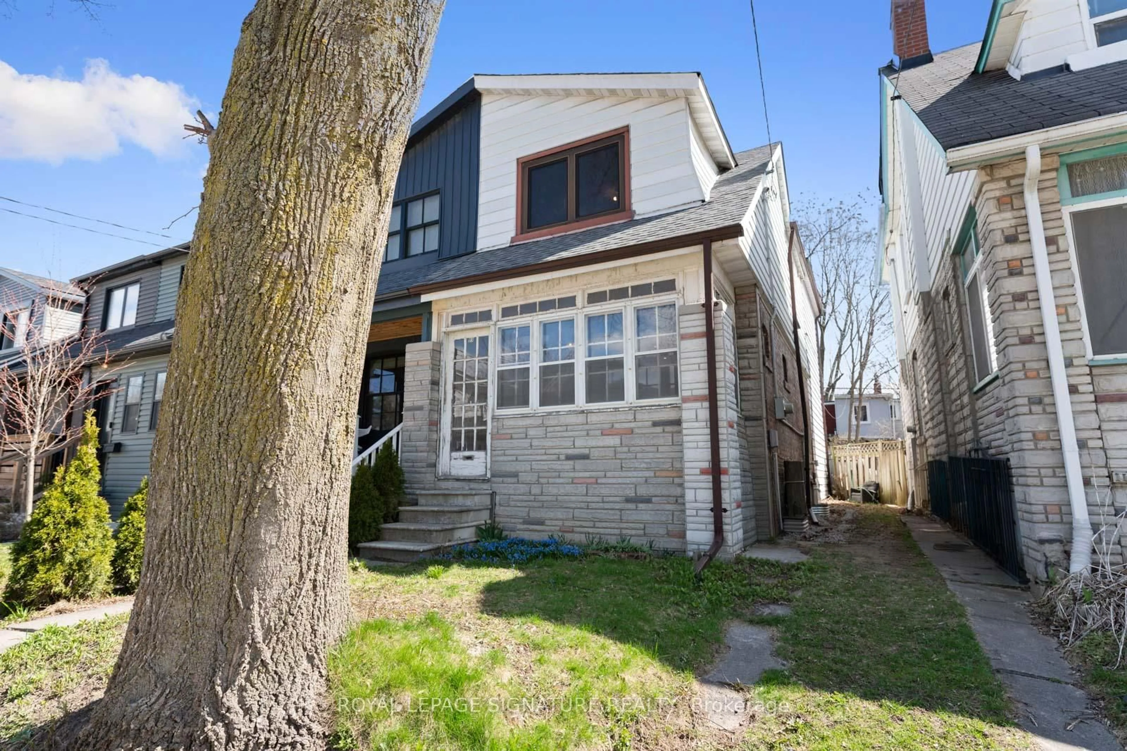 Home with brick exterior material, street for 99 Kent Rd, Toronto Ontario M4L 2X5