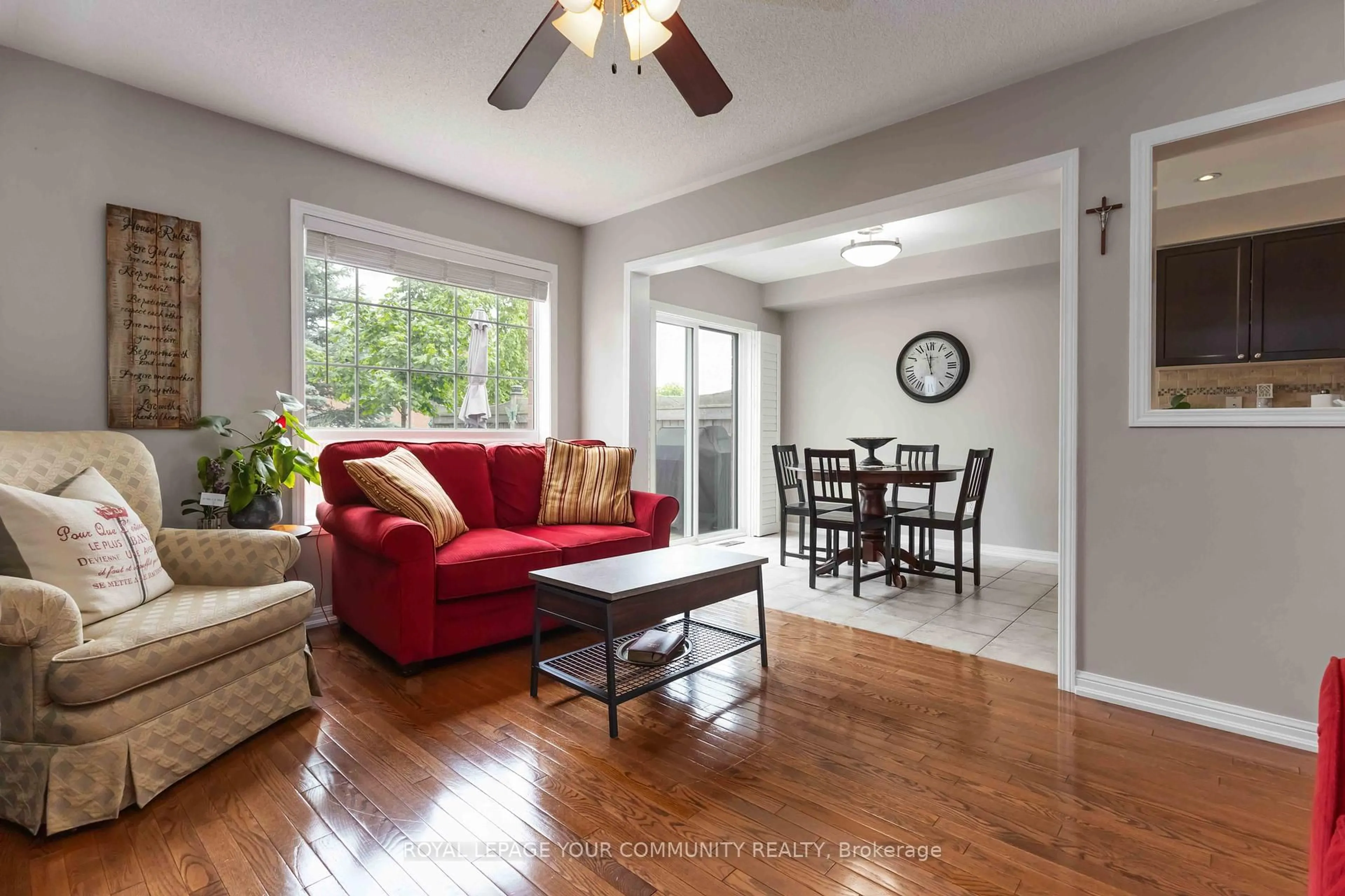 Living room with furniture, wood/laminate floor for 49 Latchford Way, Whitby Ontario L1N 9R3