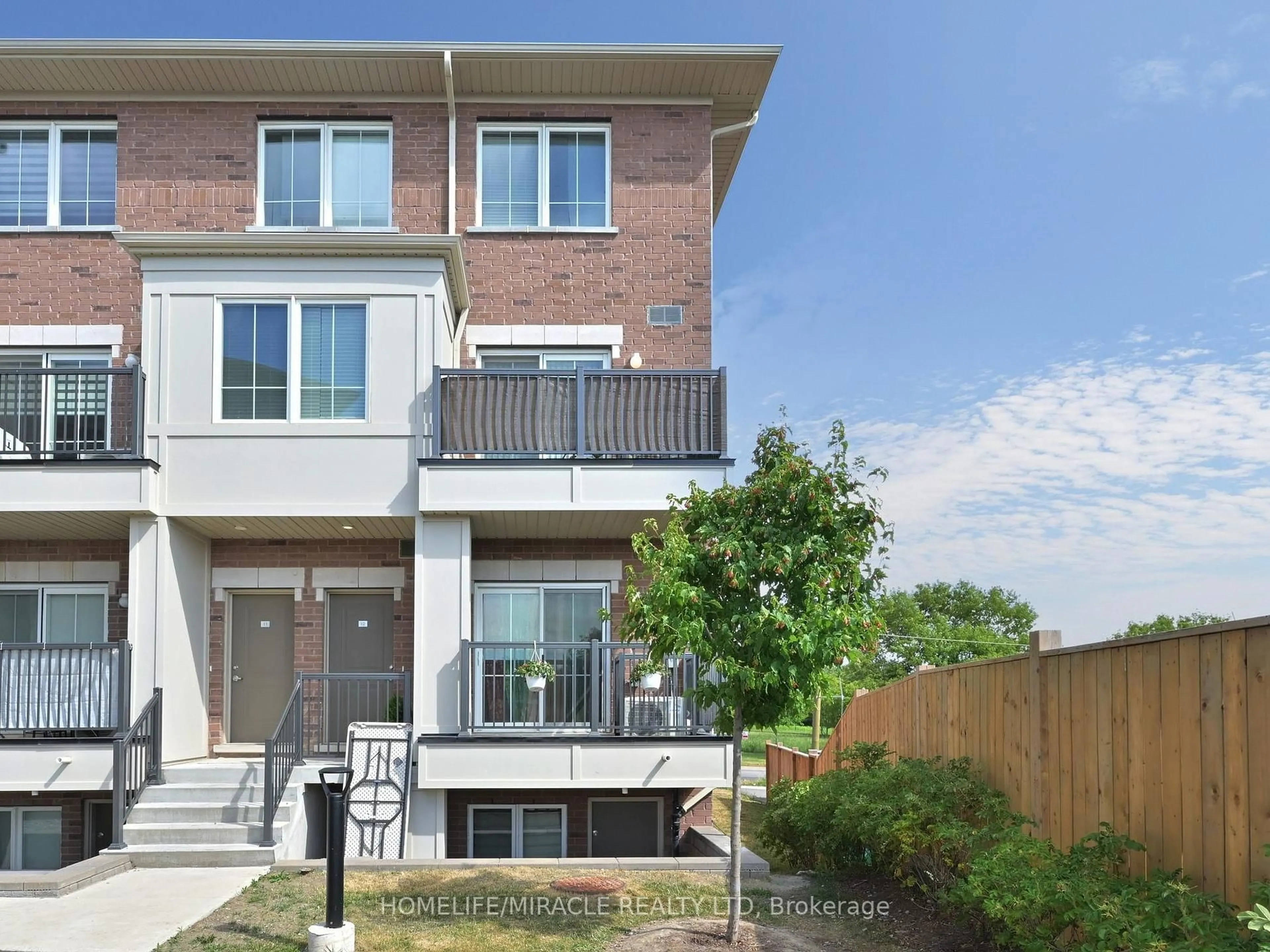 Home with brick exterior material, street for 490 Beresford Path #12, Oshawa Ontario L1H 0B2