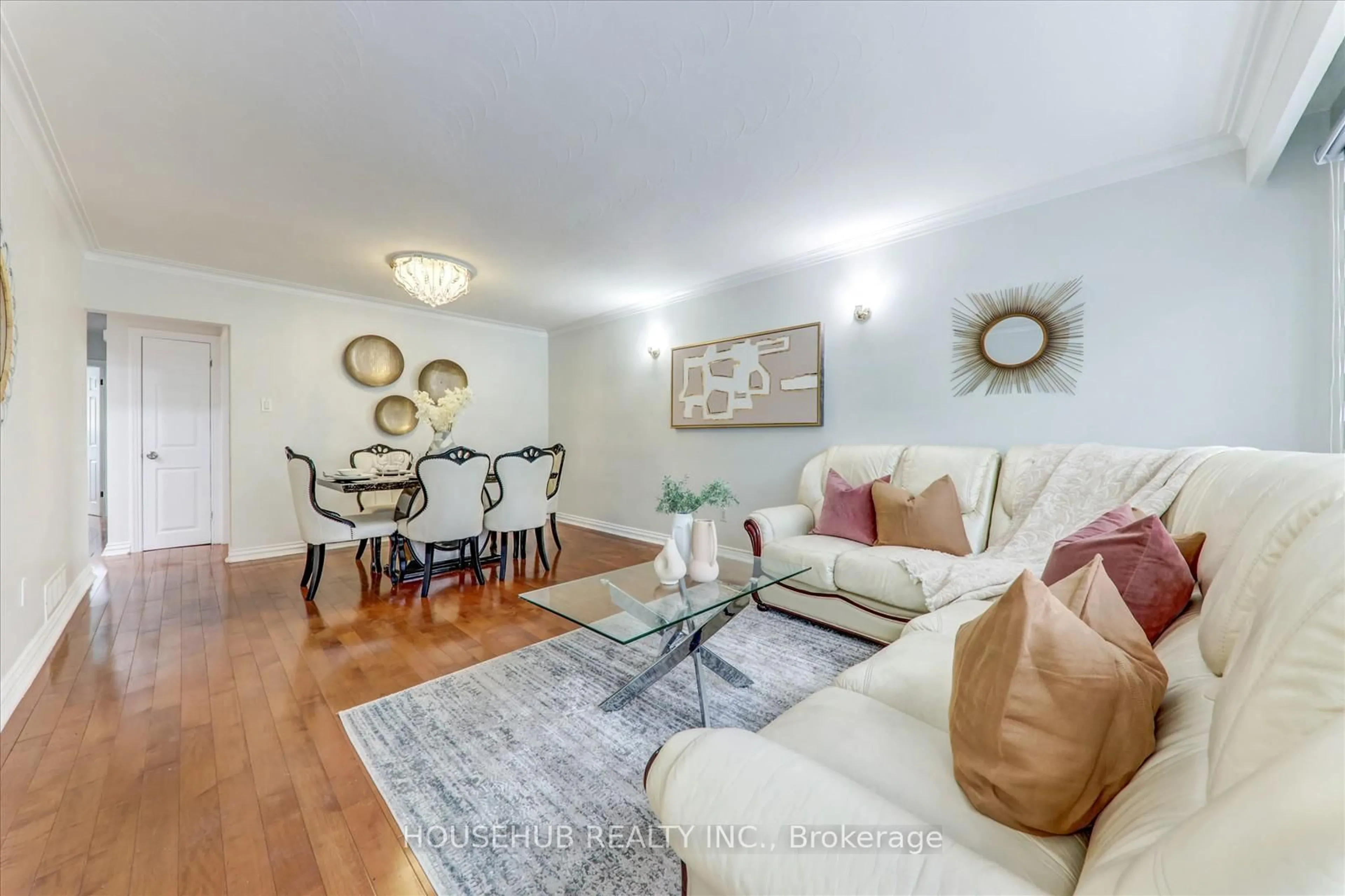 Living room with furniture, wood/laminate floor for 1074 Midland Ave, Toronto Ontario M1K 4G9