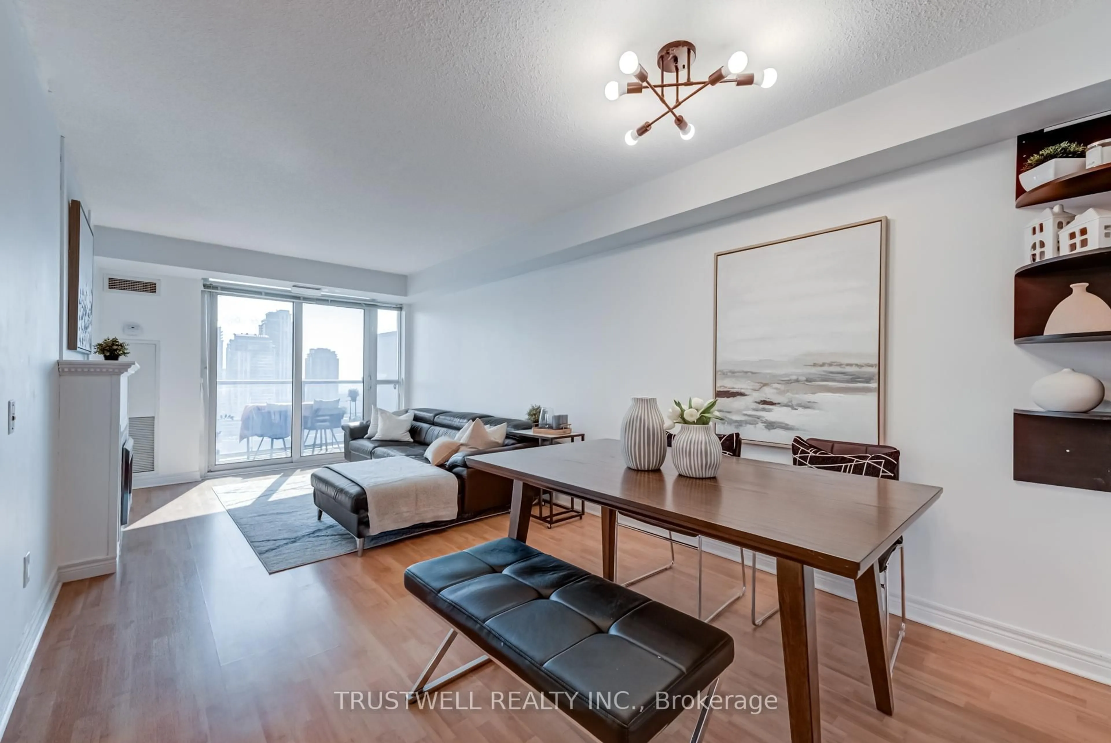 Living room with furniture, wood/laminate floor for 83 Borough Dr #2007, Toronto Ontario M1P 5E4