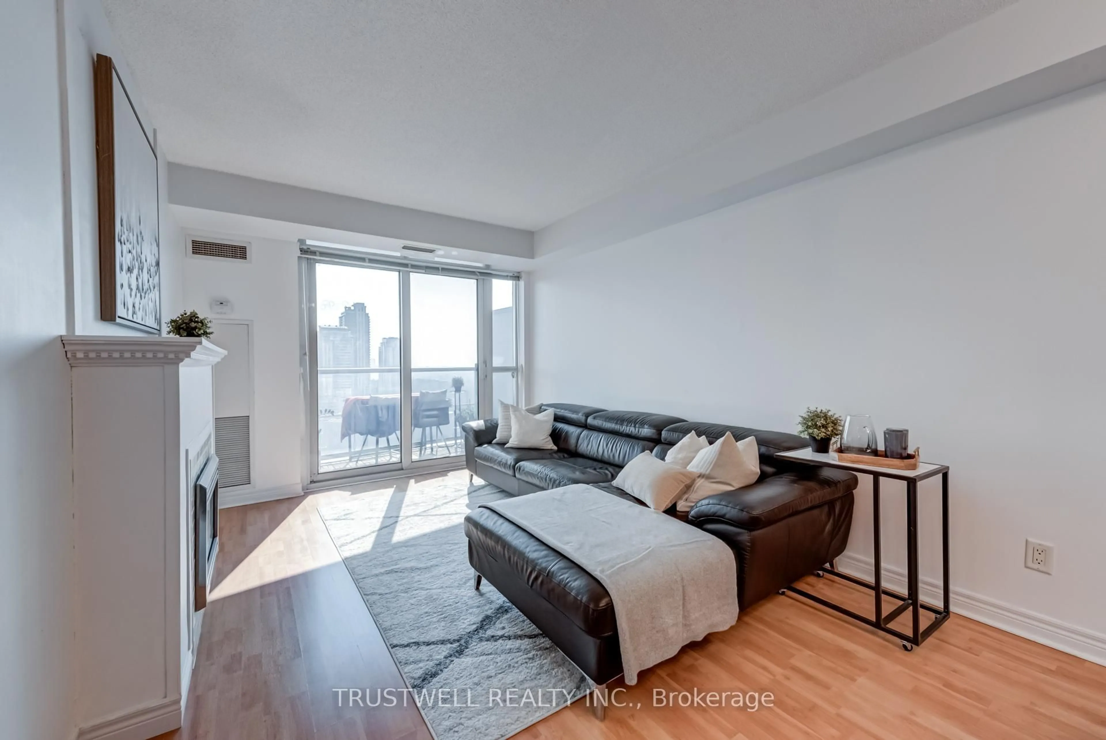 Living room with furniture, wood/laminate floor for 83 Borough Dr #2007, Toronto Ontario M1P 5E4