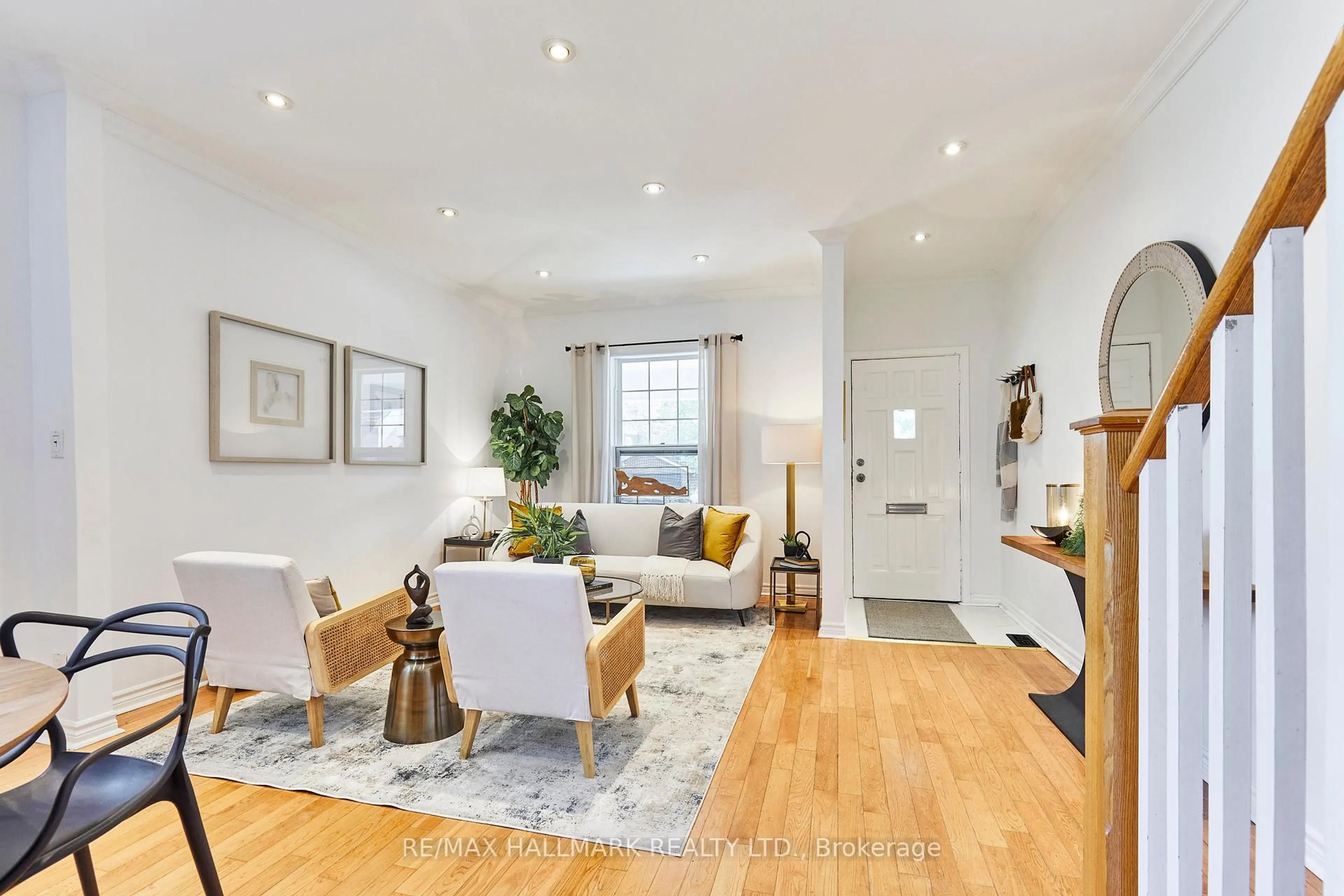 Living room with furniture, wood/laminate floor for 70 Wolverleigh Blvd, Toronto Ontario M4J 1R7