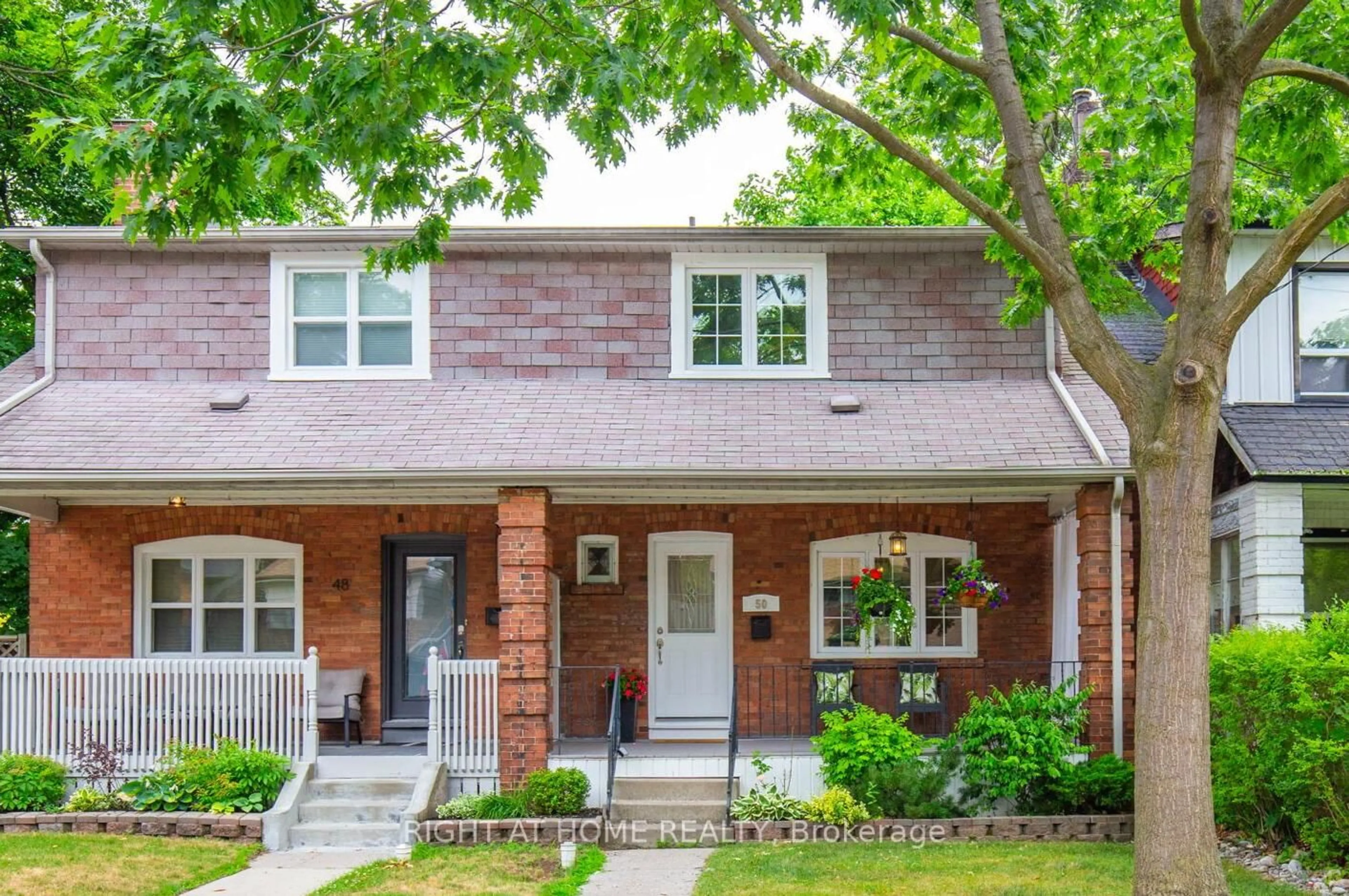 Home with brick exterior material, street for 50 Iona Ave, Toronto Ontario M4C 5J4