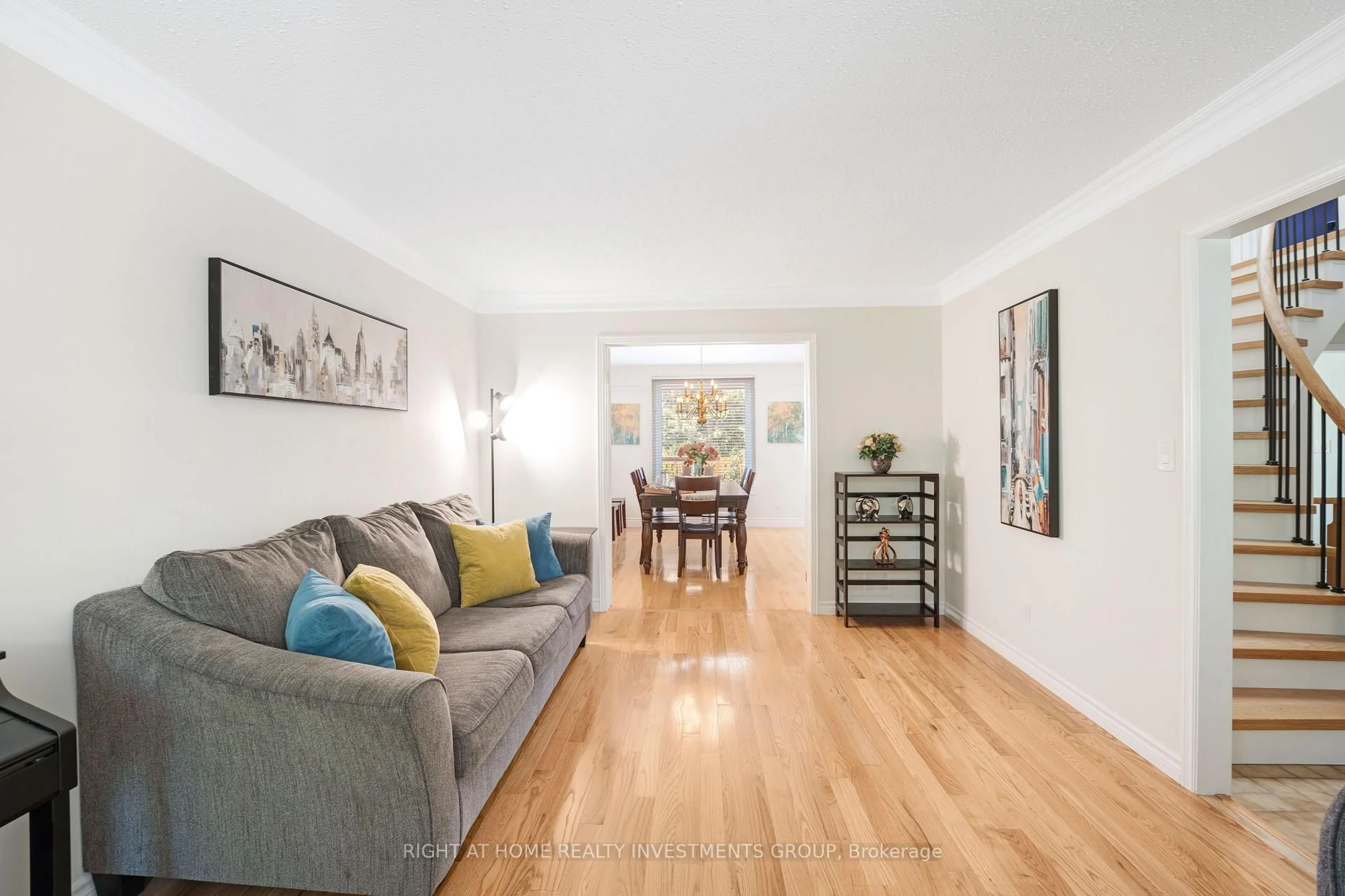 Living room with furniture, wood/laminate floor for 660 Whistler Dr, Oshawa Ontario L1J 7N7