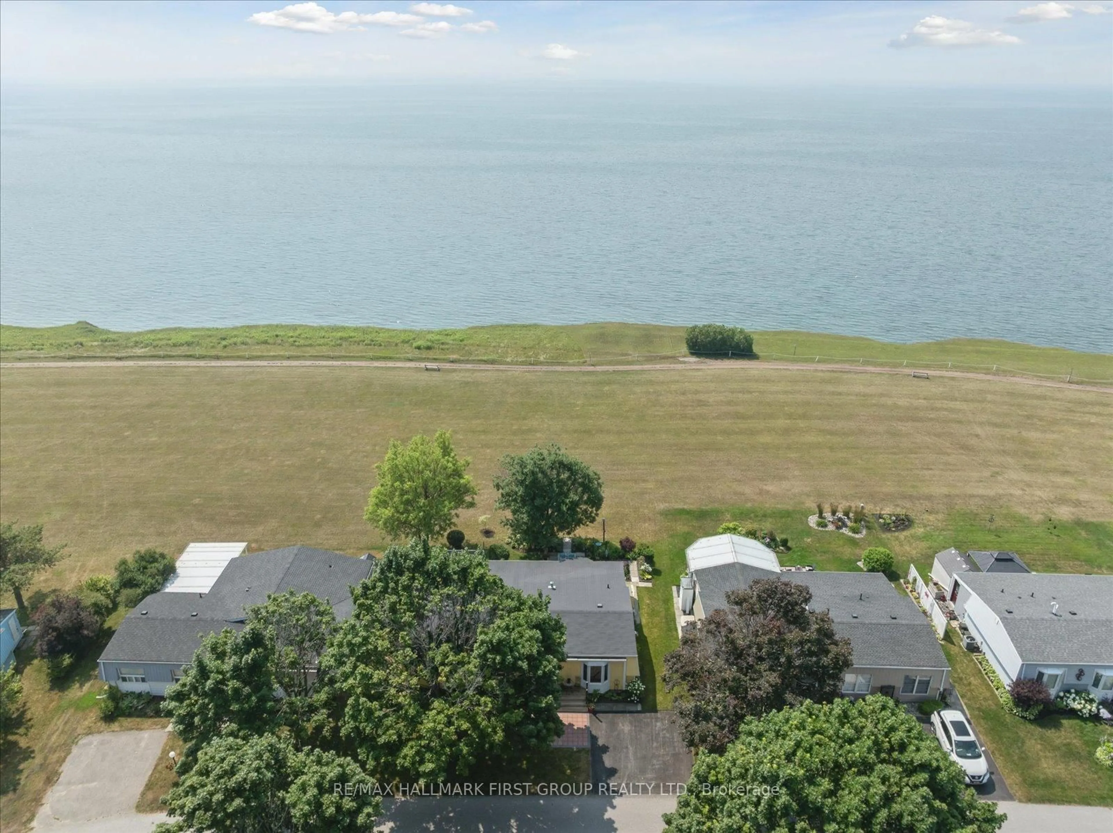 A pic from outside/outdoor area/front of a property/back of a property/a pic from drone, water/lake/river/ocean view for 27 Wilmot Tr, Clarington Ontario L1B 1A1