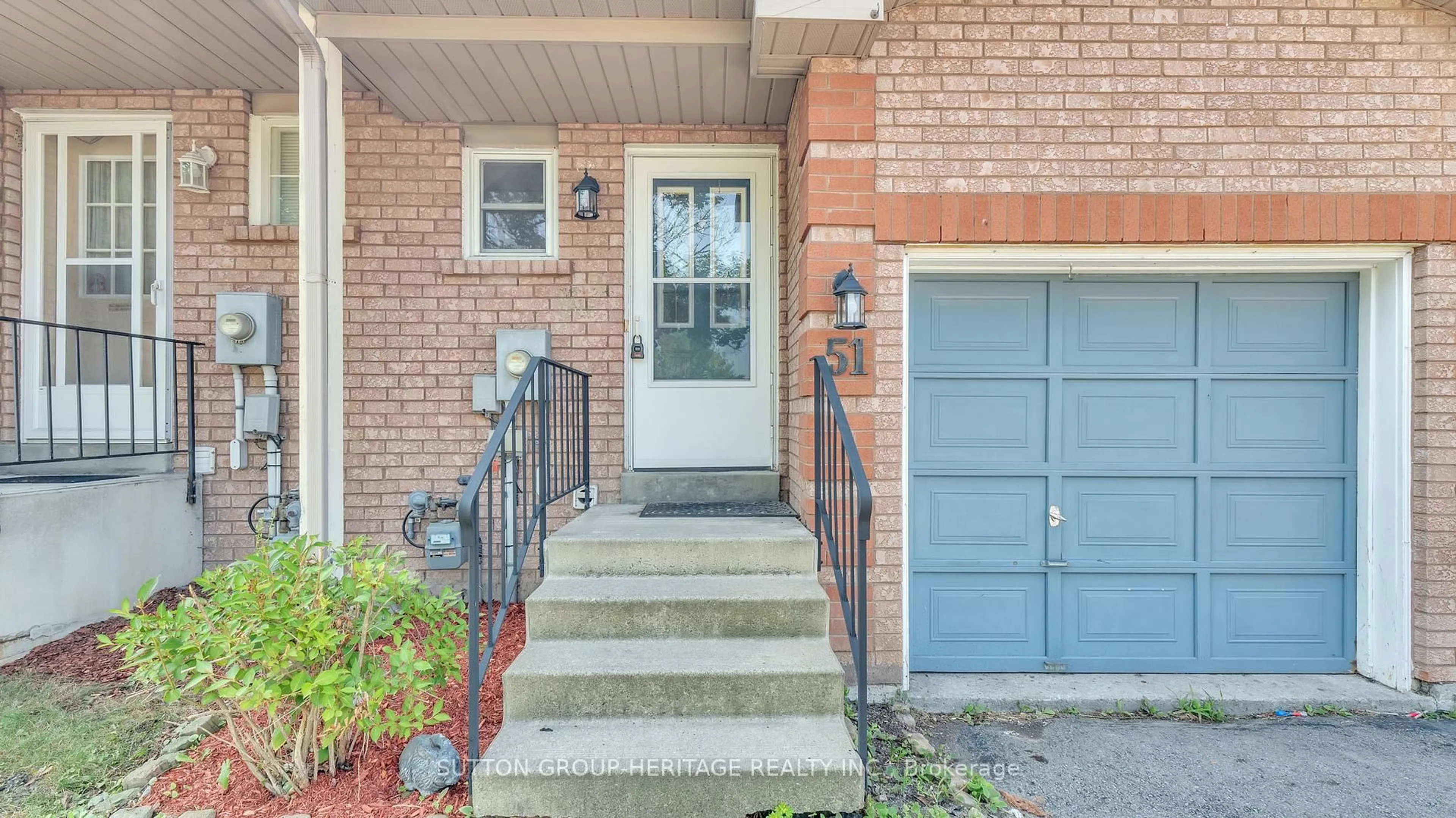 Home with brick exterior material, street for 51 Wallace Dr, Whitby Ontario L1N 9B7
