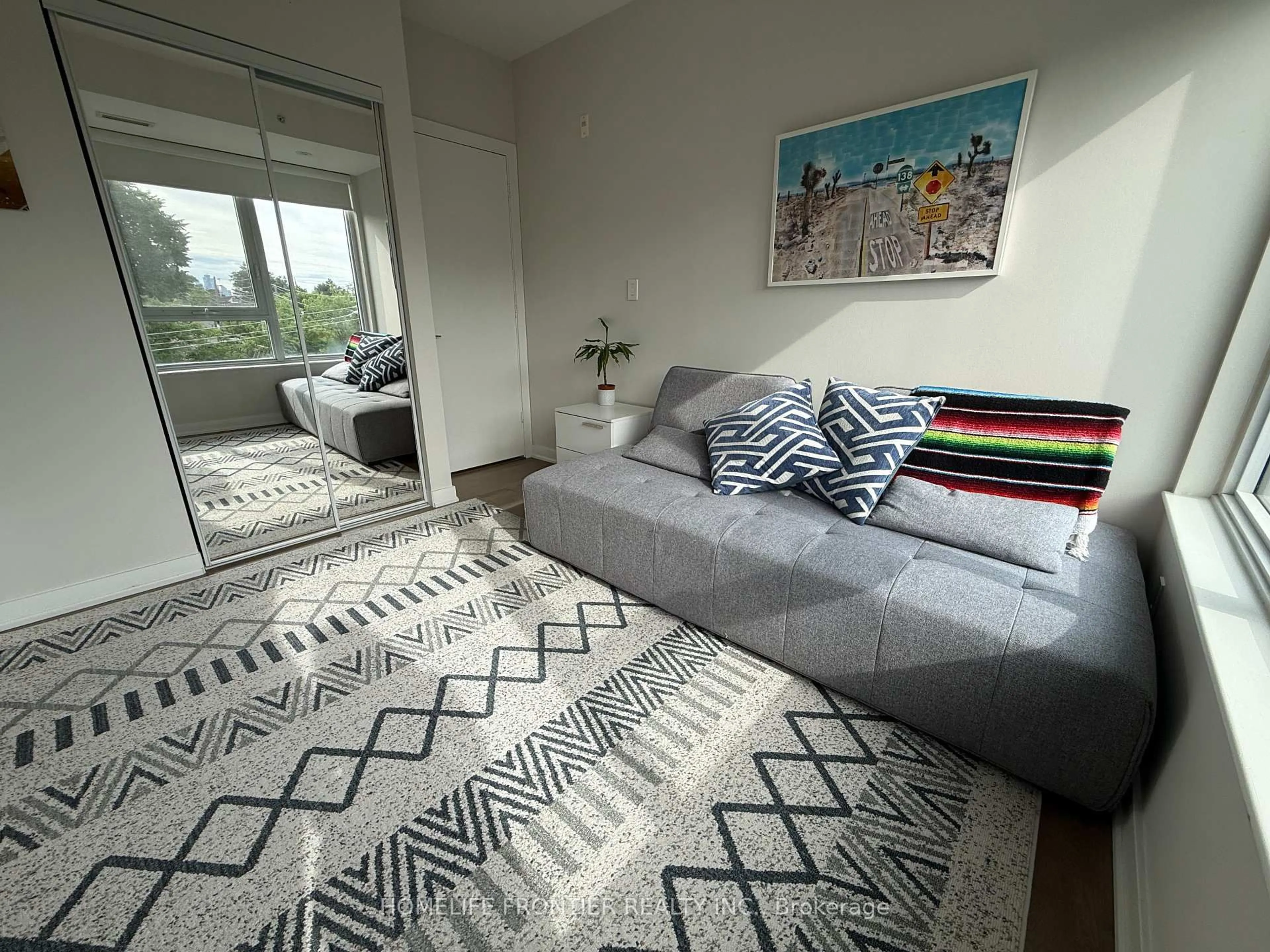 Living room with furniture, carpet floor for 1960 Queen St #405, Toronto Ontario M4L 1H8