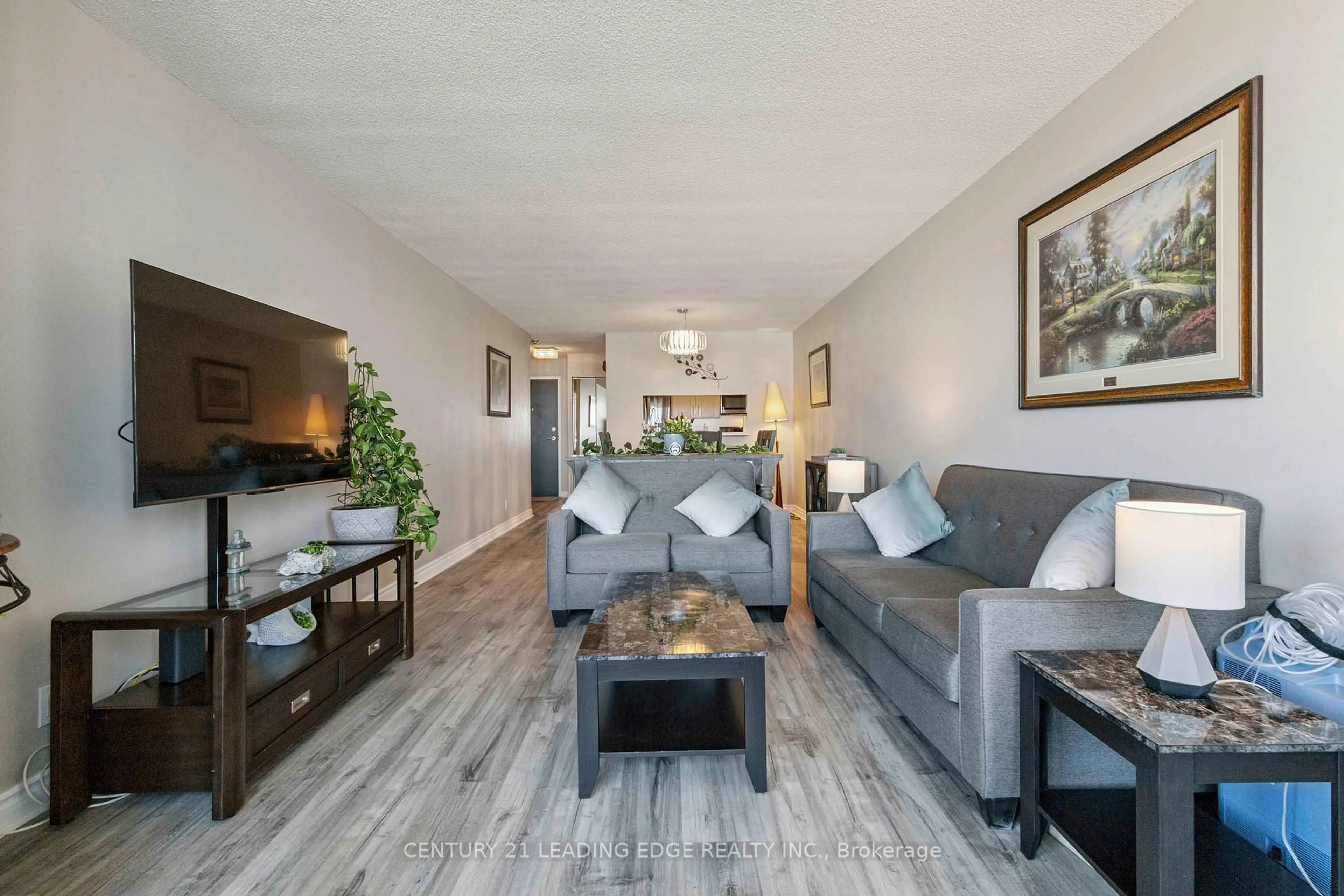 Living room with furniture, wood/laminate floor for 1665 Pickering Pkwy #809, Pickering Ontario L1V 6L4