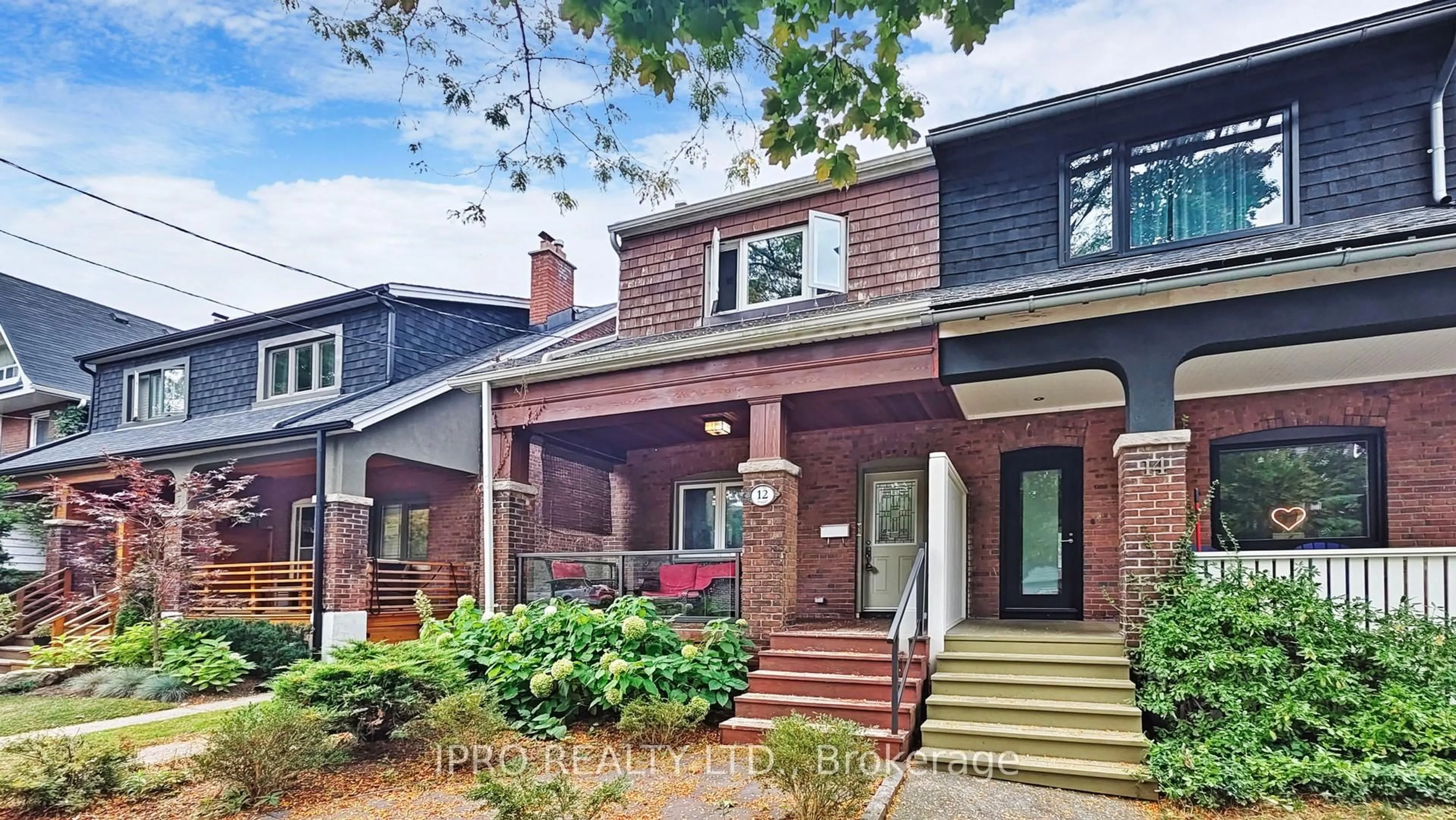 Home with brick exterior material, street for 12 Lark St, Toronto Ontario M4L 3M6