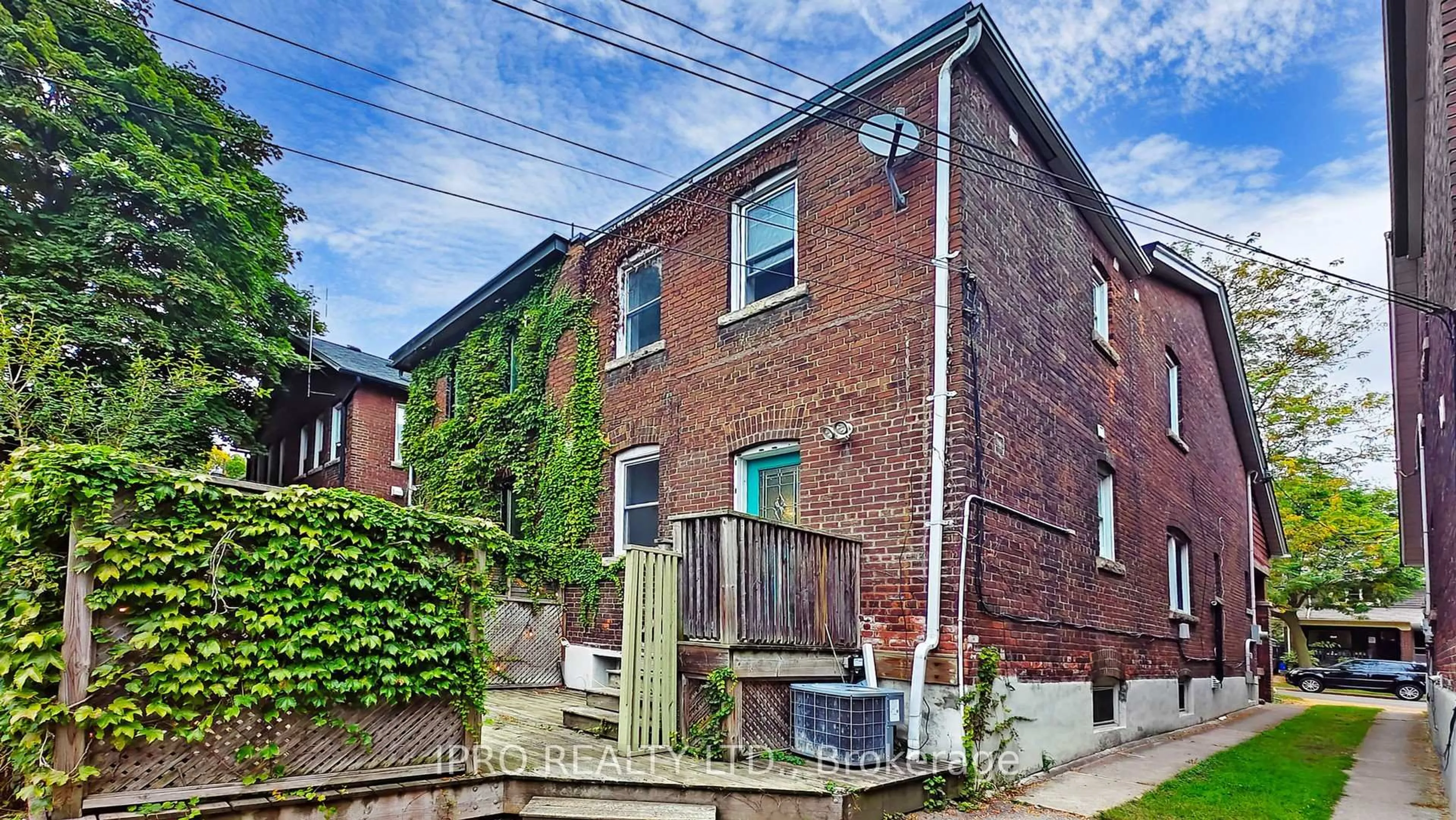 Home with brick exterior material, street for 12 Lark St, Toronto Ontario M4L 3M6