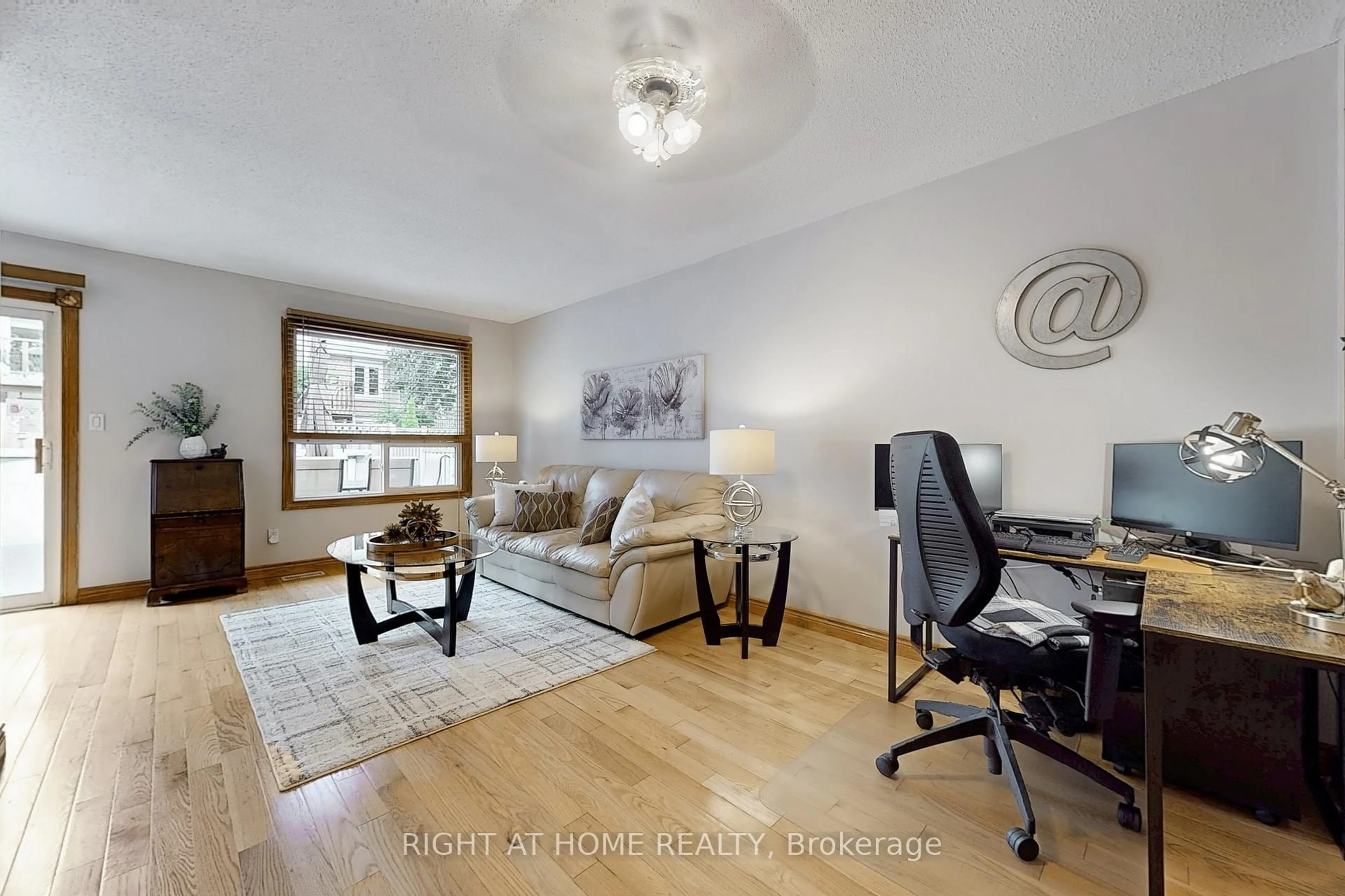 Living room with furniture, wood/laminate floor for 174 Overbank Dr, Oshawa Ontario L1J 7Y5