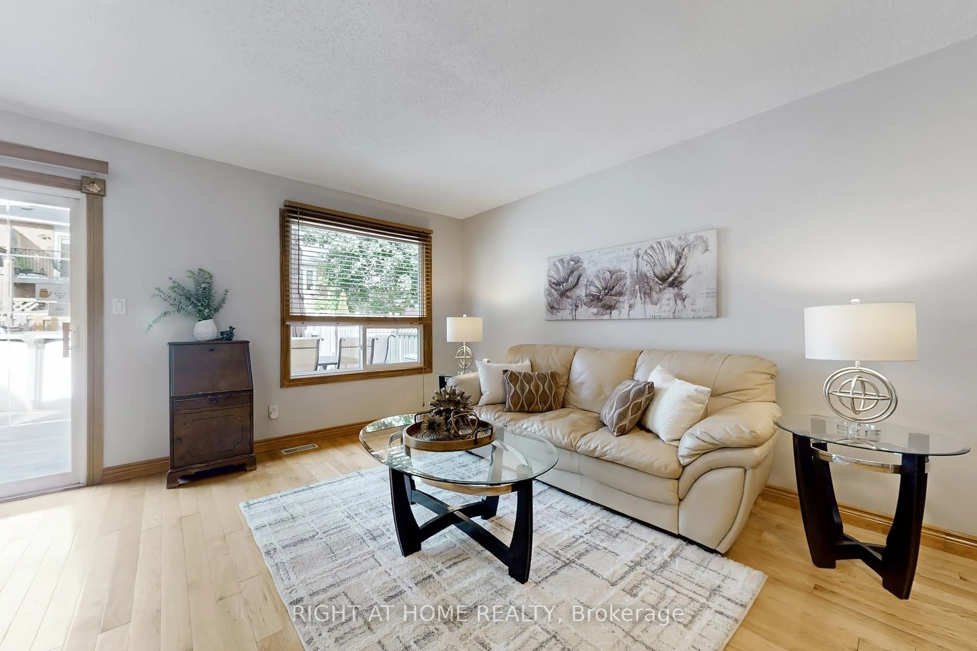 Living room with furniture, wood/laminate floor for 174 Overbank Dr, Oshawa Ontario L1J 7Y5