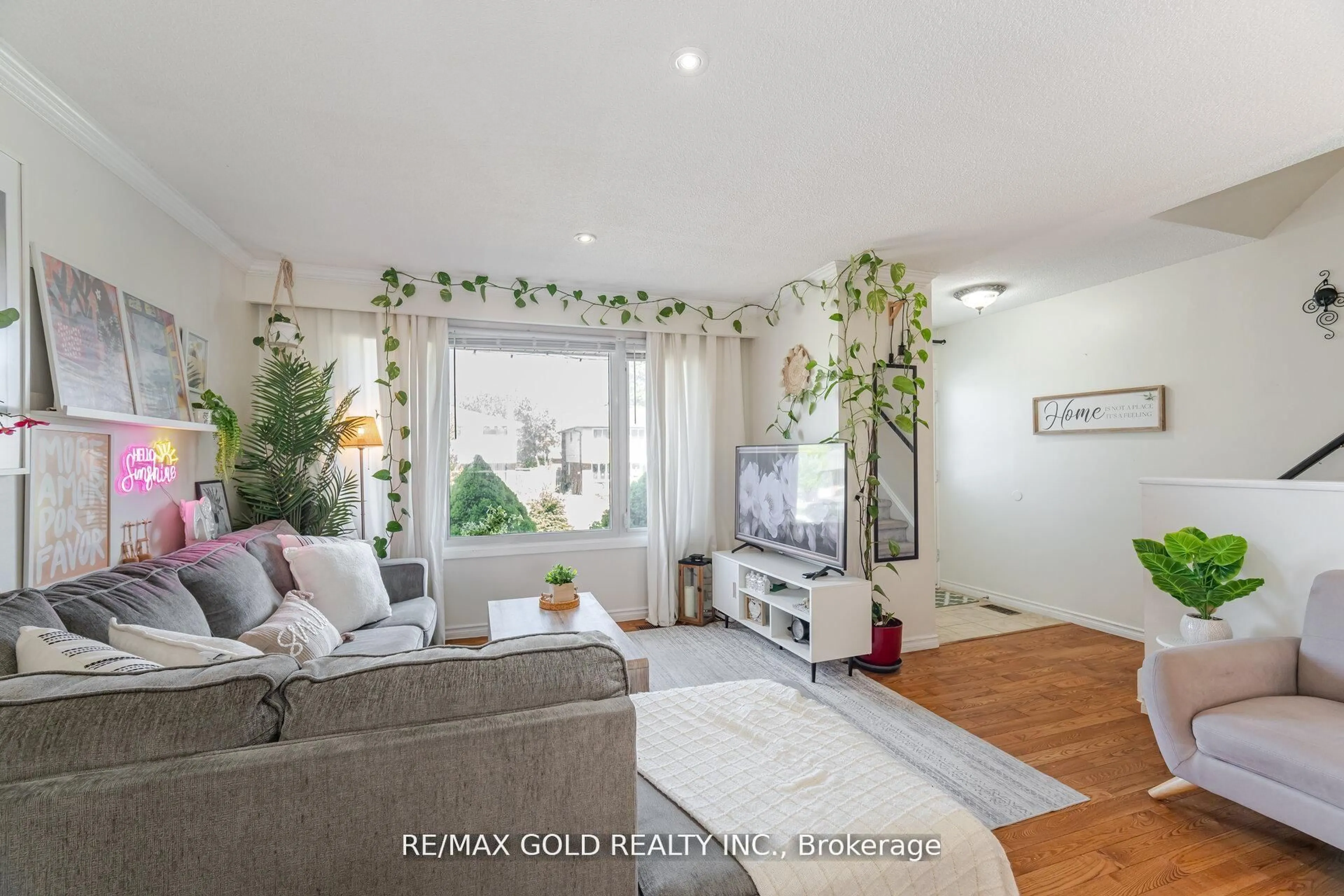 Living room with furniture, wood/laminate floor for 232 Durham St, Oshawa Ontario L1J 5R3