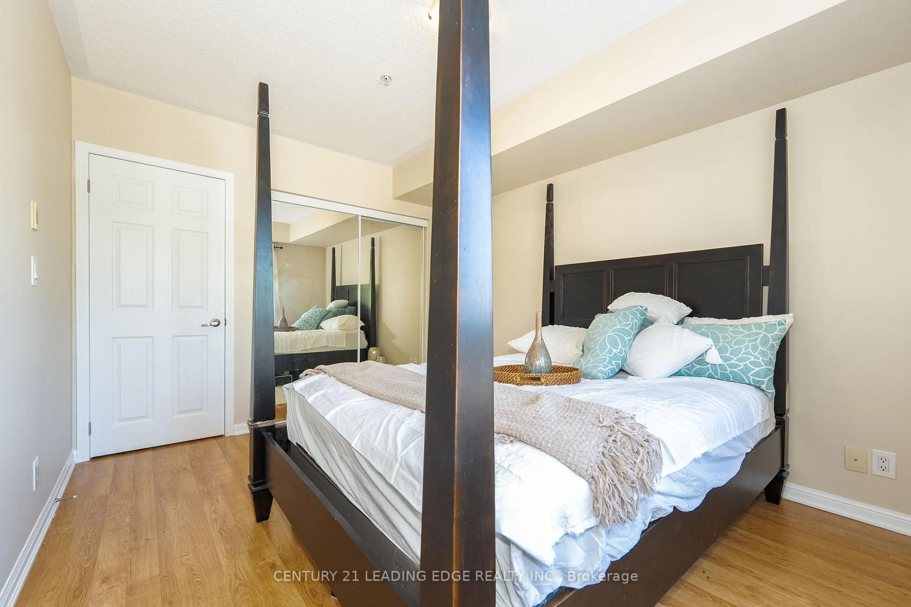 Bedroom with bed, wood/laminate floor for 60 MENDELSSOHN St #213, Toronto Ontario M1L 0G9